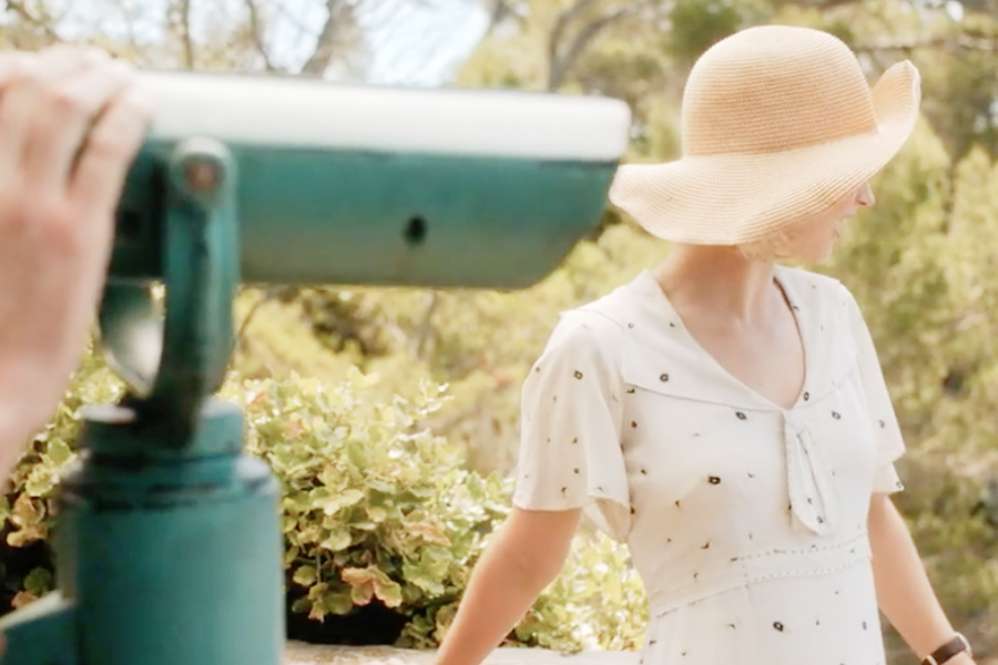 Image of Lily James wearing a 1930s dress and hat in the movie "Rebecca"