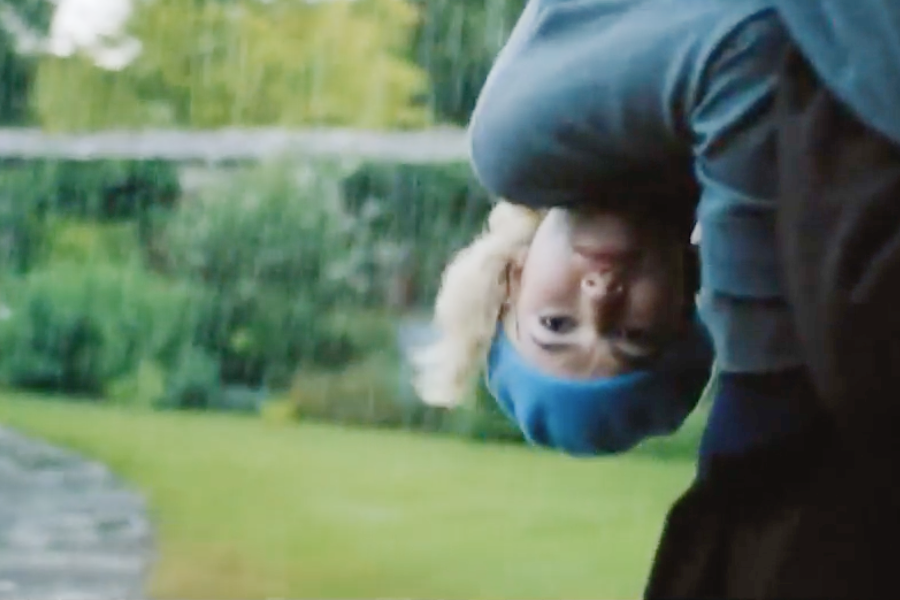 Image of Lily James wearing a 1930s hat and blouse in the movie "Rebecca"