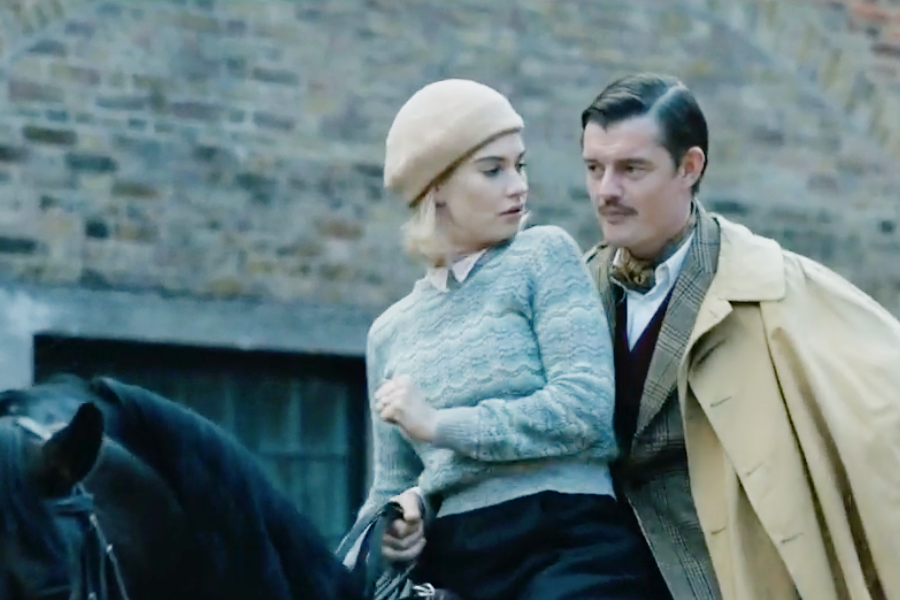 Image of Lily James wearing a 1930s pants and sweater outfit in the movie "Rebecca"