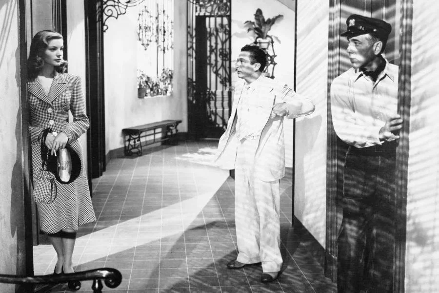 Image of Lauren Bacall wearing a skirtsuit in the 1940s