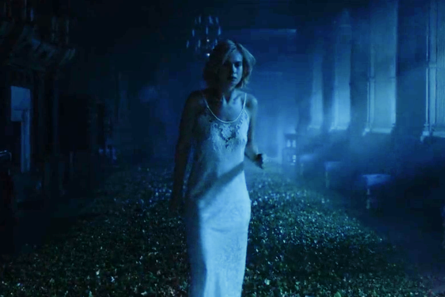 Image of Lily James wearing a vintage negligee in the movie "Rebecca"