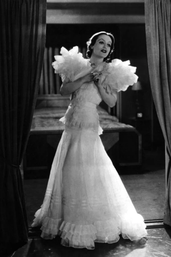 Joan Crawford wearing a famous gown in the 1930s