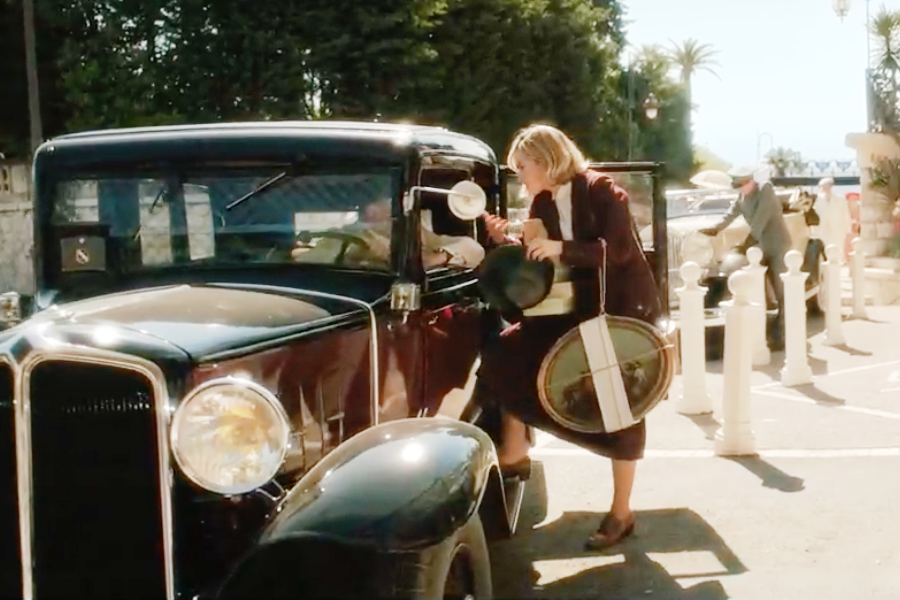 Image of Lily James wearing a 1930s skirt suit in the movie "Rebecca"