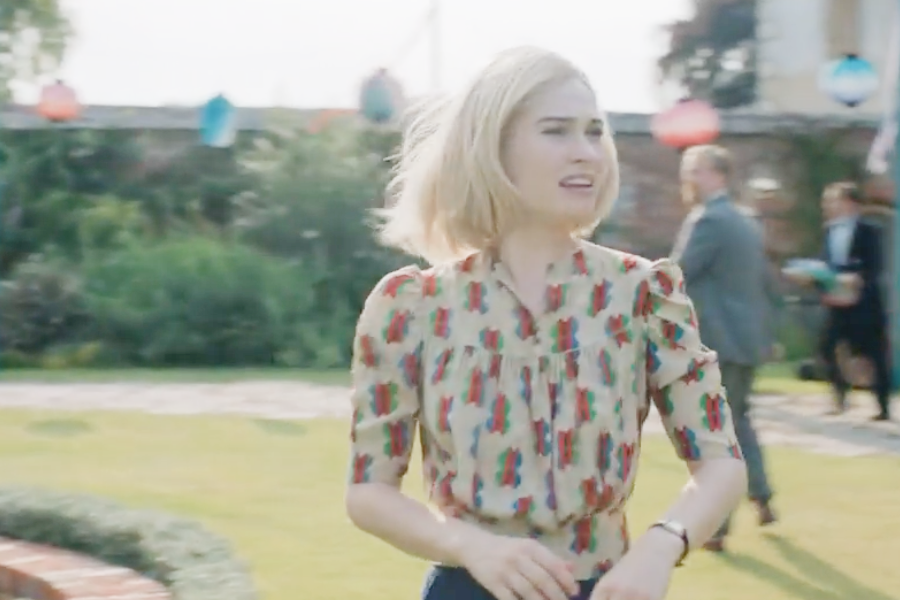 Image of Lily James wearing a 1930s hat and blouse in the movie "Rebecca"