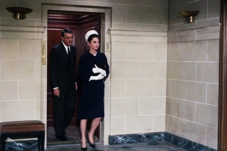 Audrey Hepburn wearing a black dress in Charade