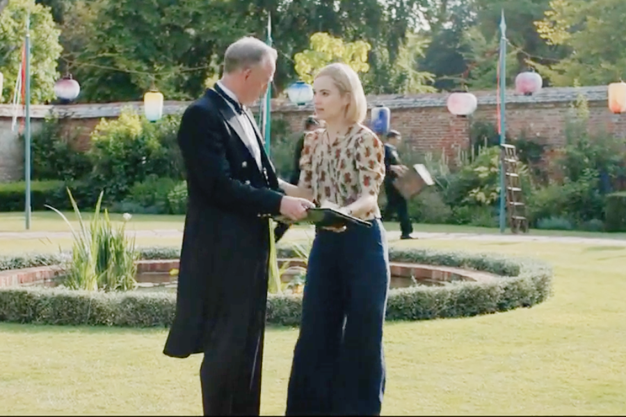 Image of Lily James wearing a 1930s hat and blouse in the movie "Rebecca"