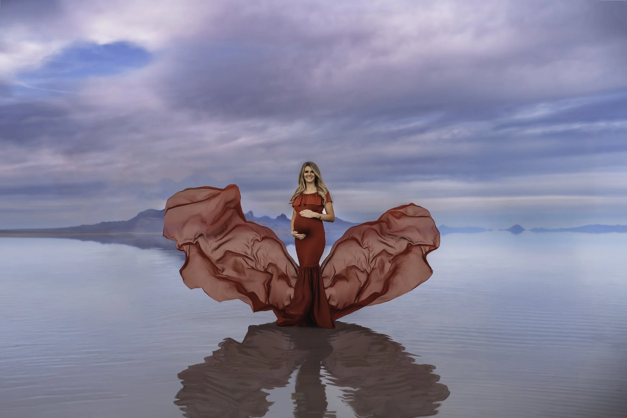 Salt Flats Maternity Session Red Dress Cloudy Sky Water