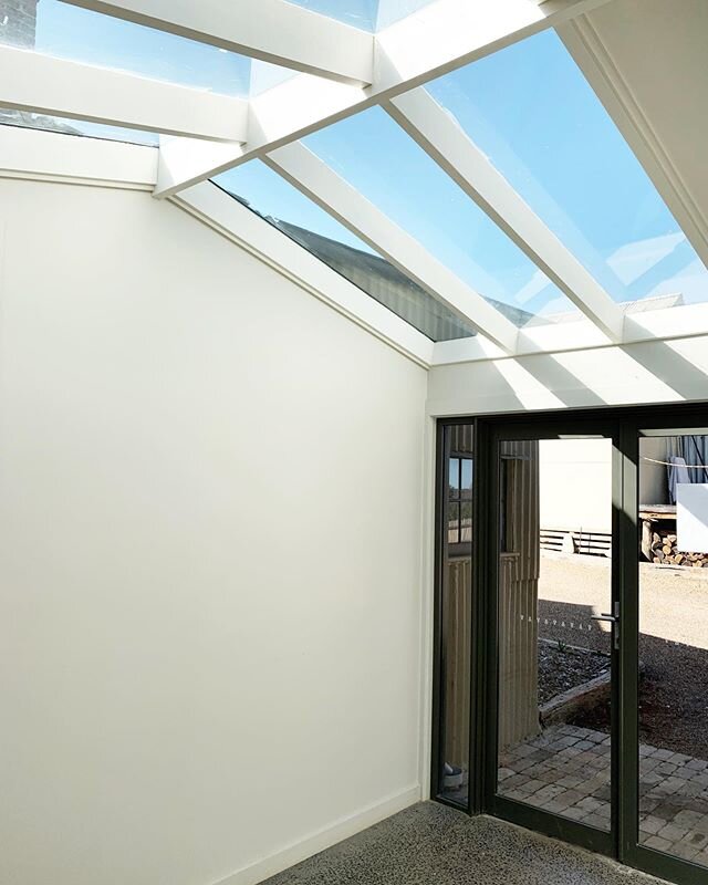 Adding skylights can completely transform a space. This room is now flooded with natural light and feels a lot bigger!