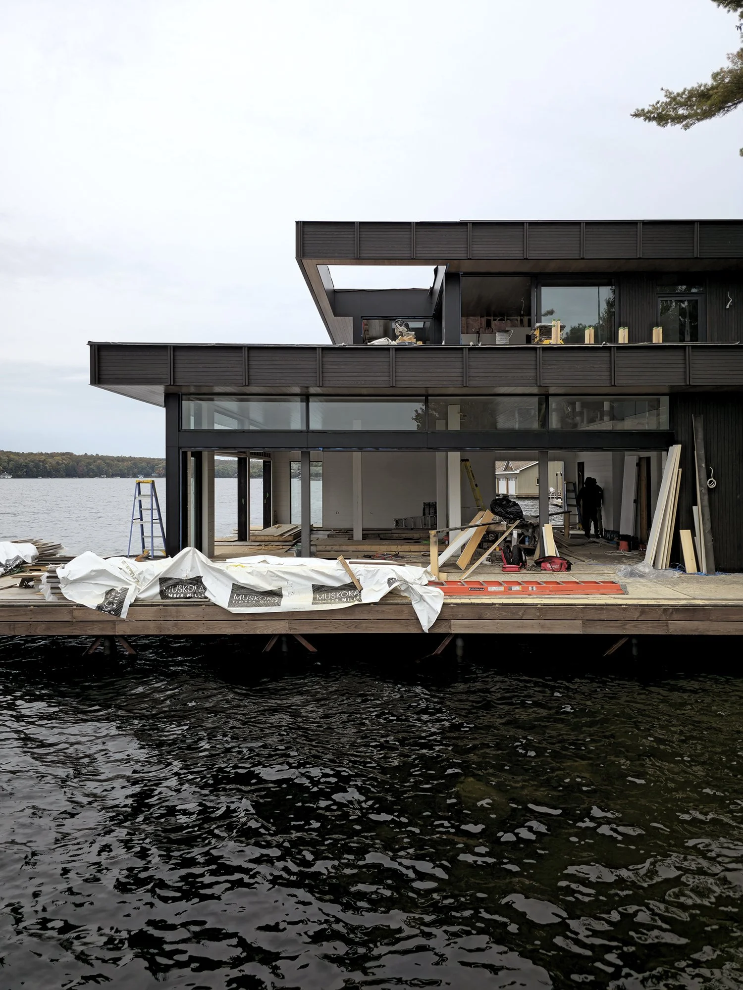 Bedrock Point Boathouse extending from the exposed Canadian Shield shoreline of Lake Muskoka