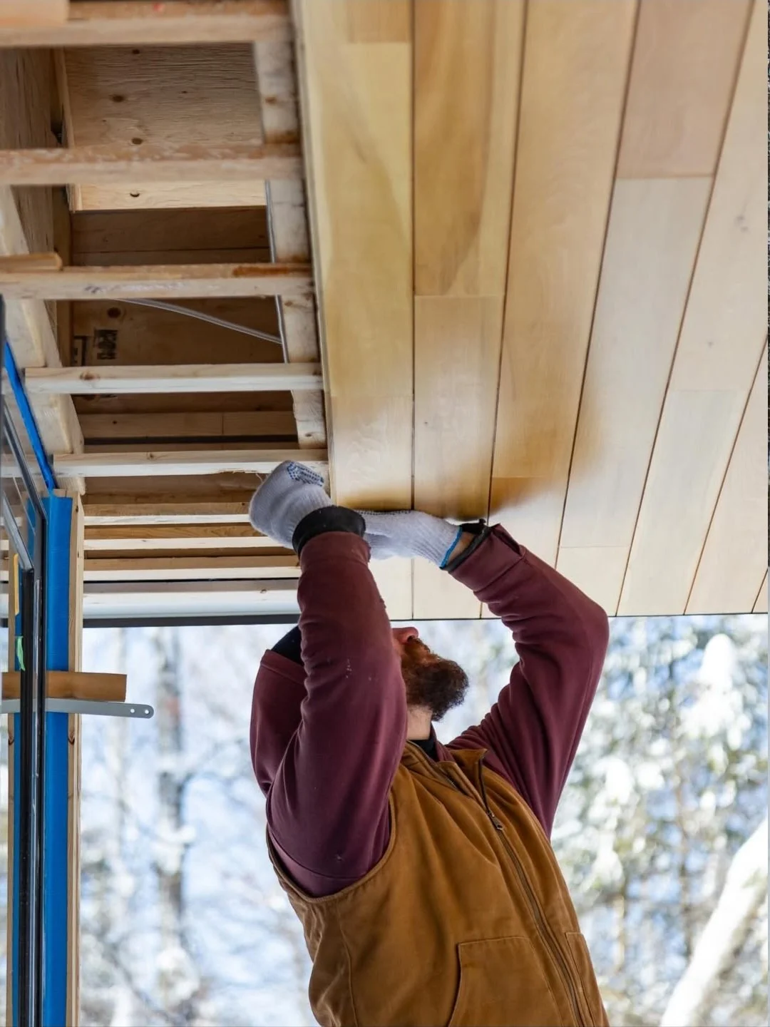 Modern Haliburton Cottage under construction by Daymark, wood soffit installation