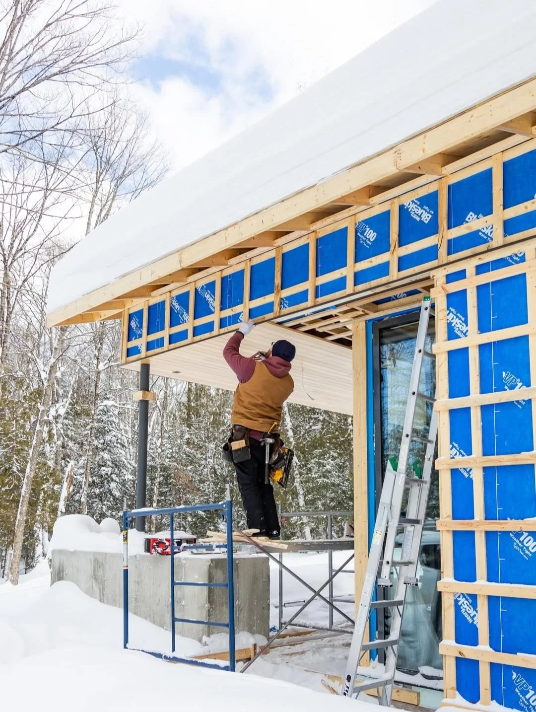 Modern Haliburton Cottage under construction by Daymark, wood soffit installation