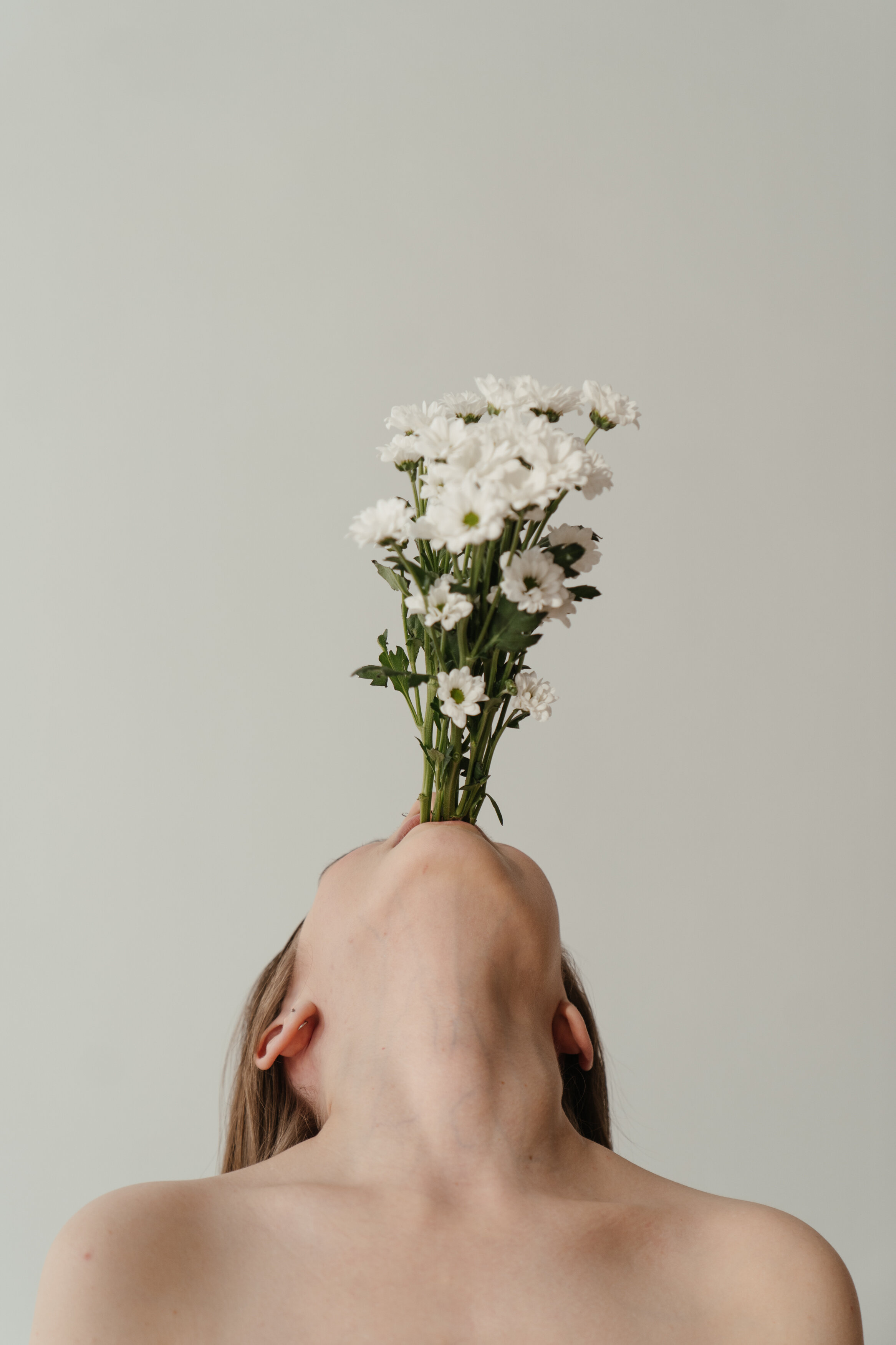 woman-holding-white-flower-bouquet-4273354.jpg