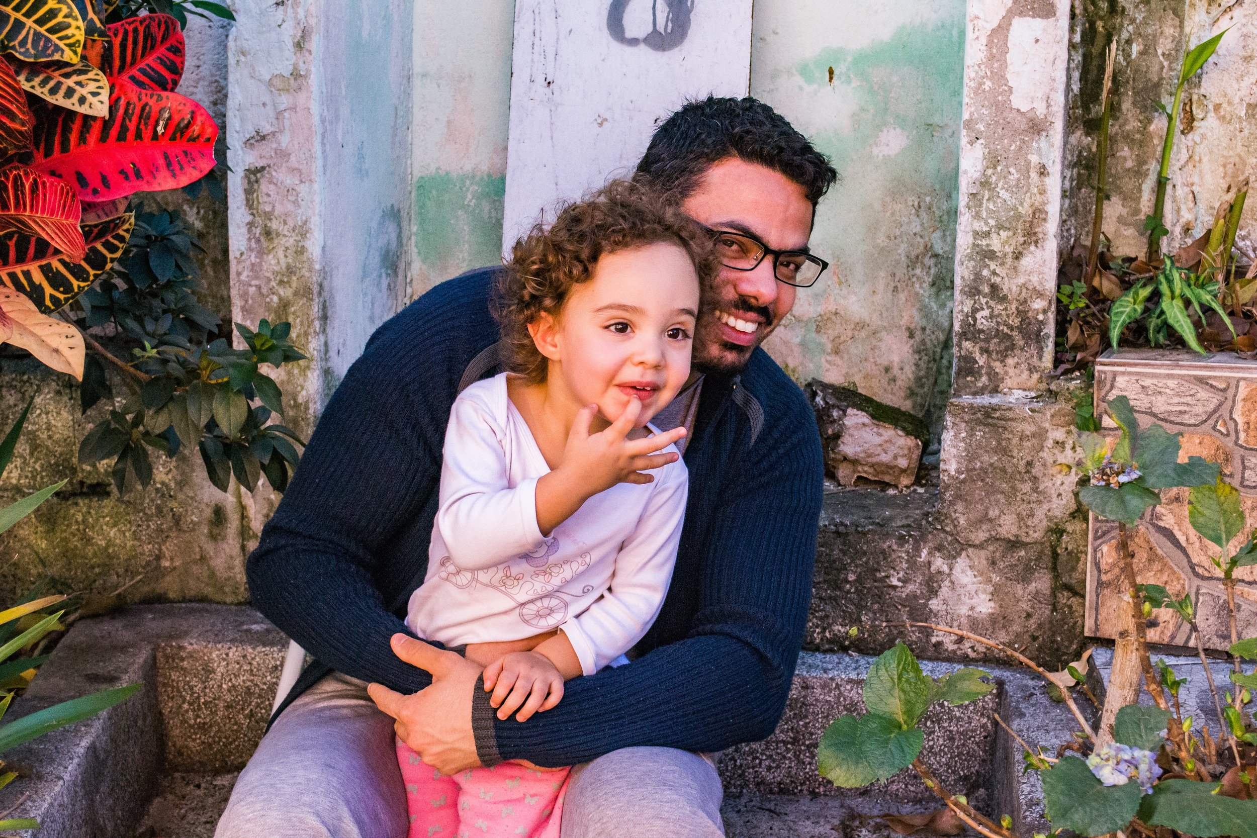 Dad and daughter outside on stone steps