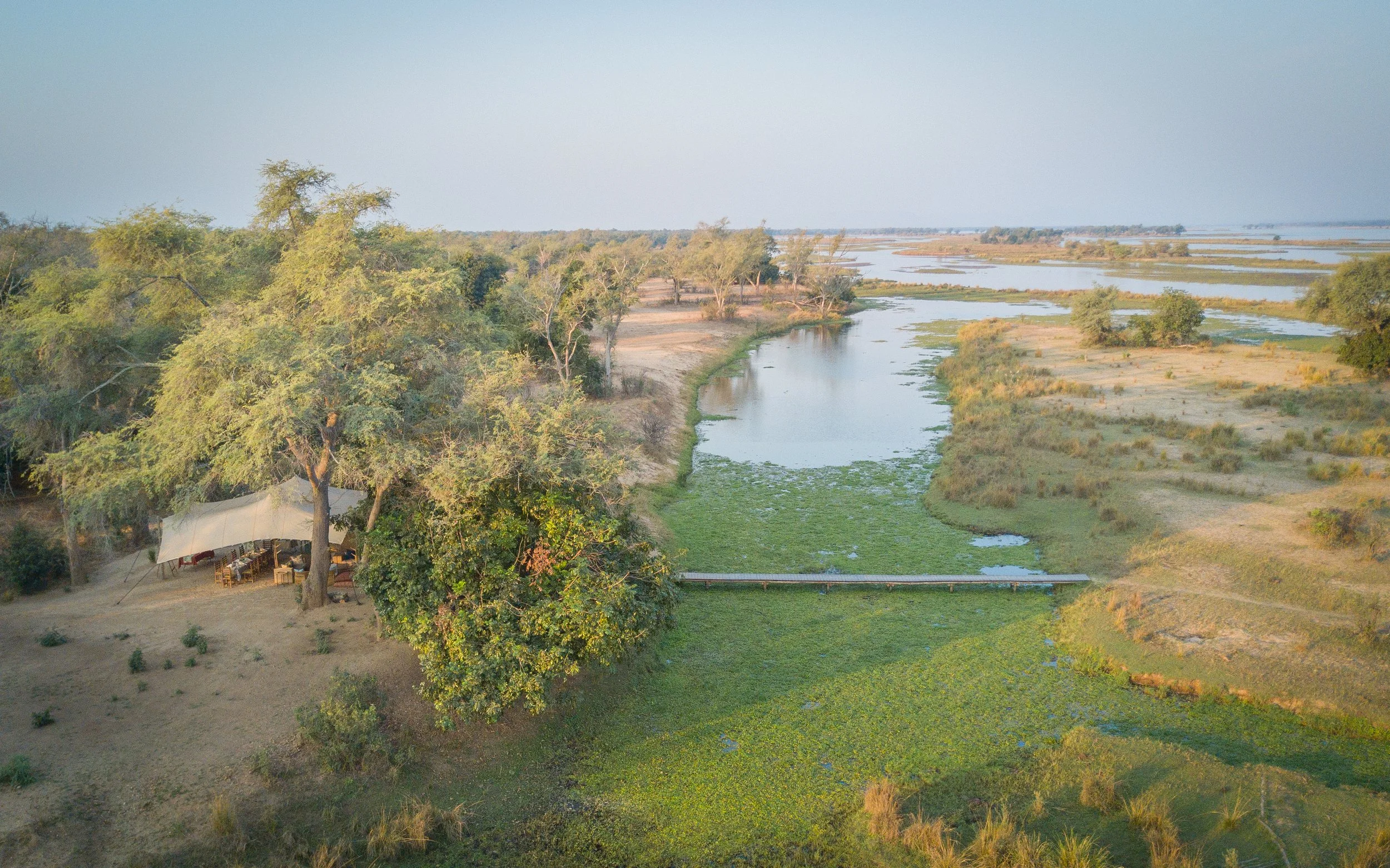 Luxury tented camp overlooking the Busanga Plains in Kafue National Park, Zambia, surrounded by seasonal wetlands and one of Africa's most remarkable safari landscapes.