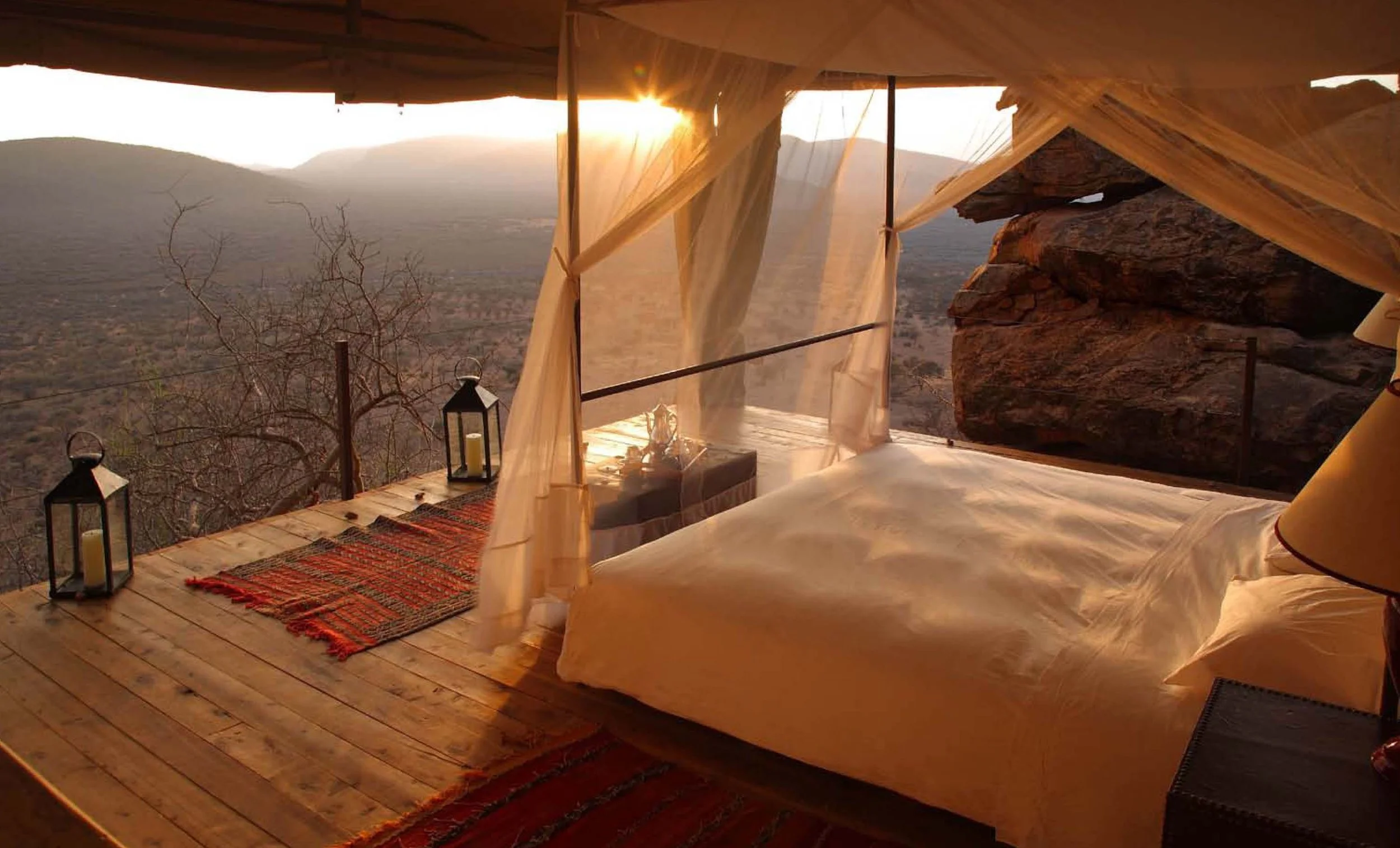 Bedroom at Saruni Samburu with panoramic views of Mount Ololokwe, the sacred mountain of the Samburu people, in Kalama Conservancy, northern Kenya.
