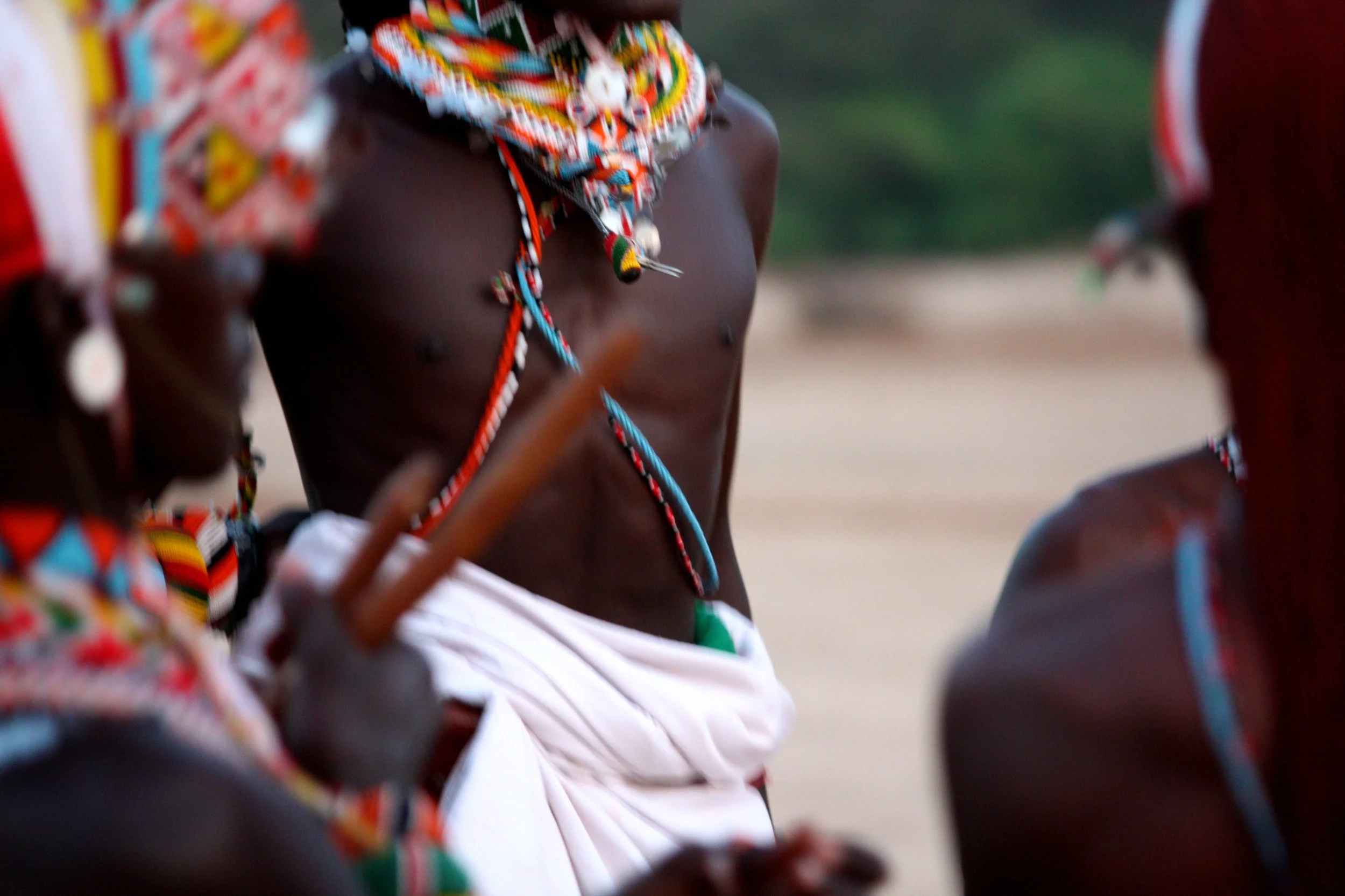 Close-up of a Samburu warrior wearing traditional beadwork at Kipsing Lugga in northern Kenya, celebrating the rich cultural heritage of the Samburu people.