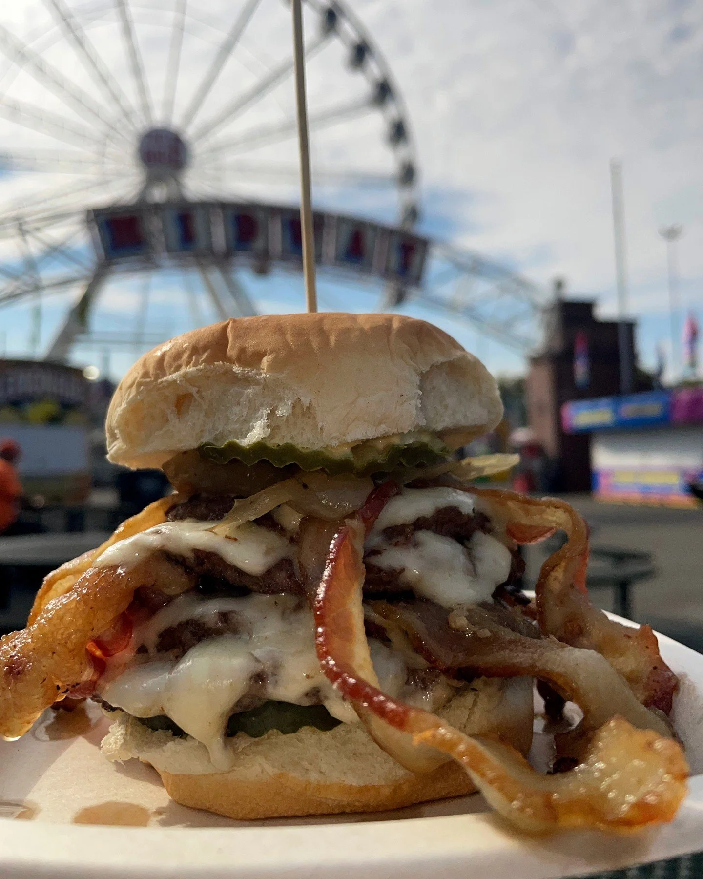 The Quadfather is BACK for November only!
A Big E favorite returns: 4 patties, 4 strips of bacon, 4 slices of American cheese, 4 pickle chips, our famous fried onions, and signature sauce... stacked to perfection🤌
Missed it at The Big E? Now&rsquo;s