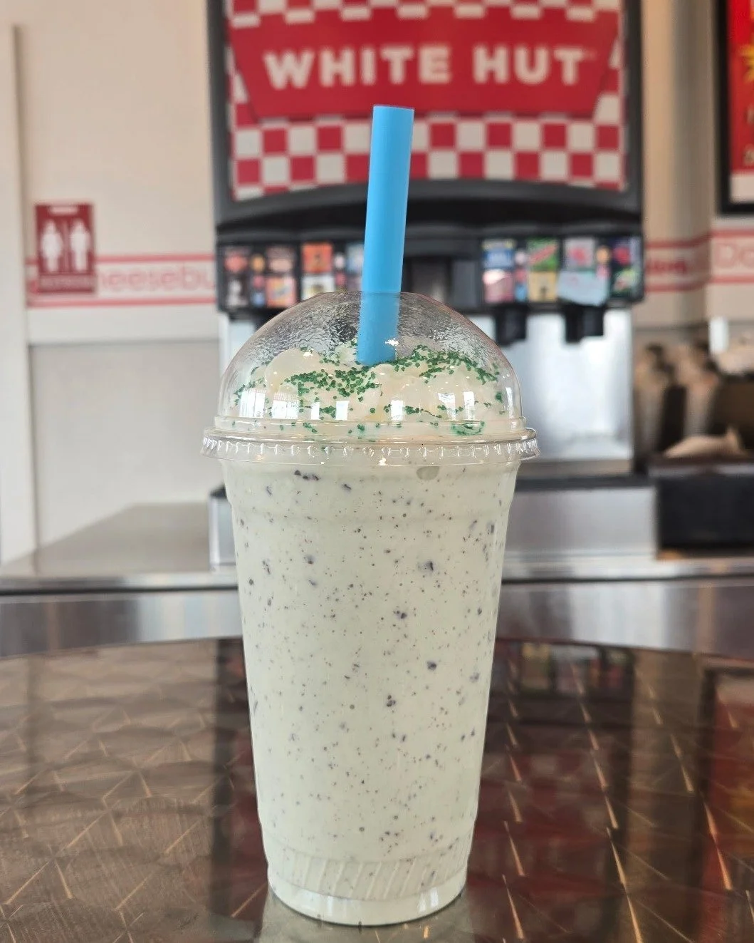 Don&rsquo;t let March end without trying our Mint Madness Shake. 🍀
Mint chocolate chip topped with whipped cream and green crystal sprinkles.
Only here for a few more days!
#whitehut #mintmarchmadnessshake #whatsbetterthanthehut