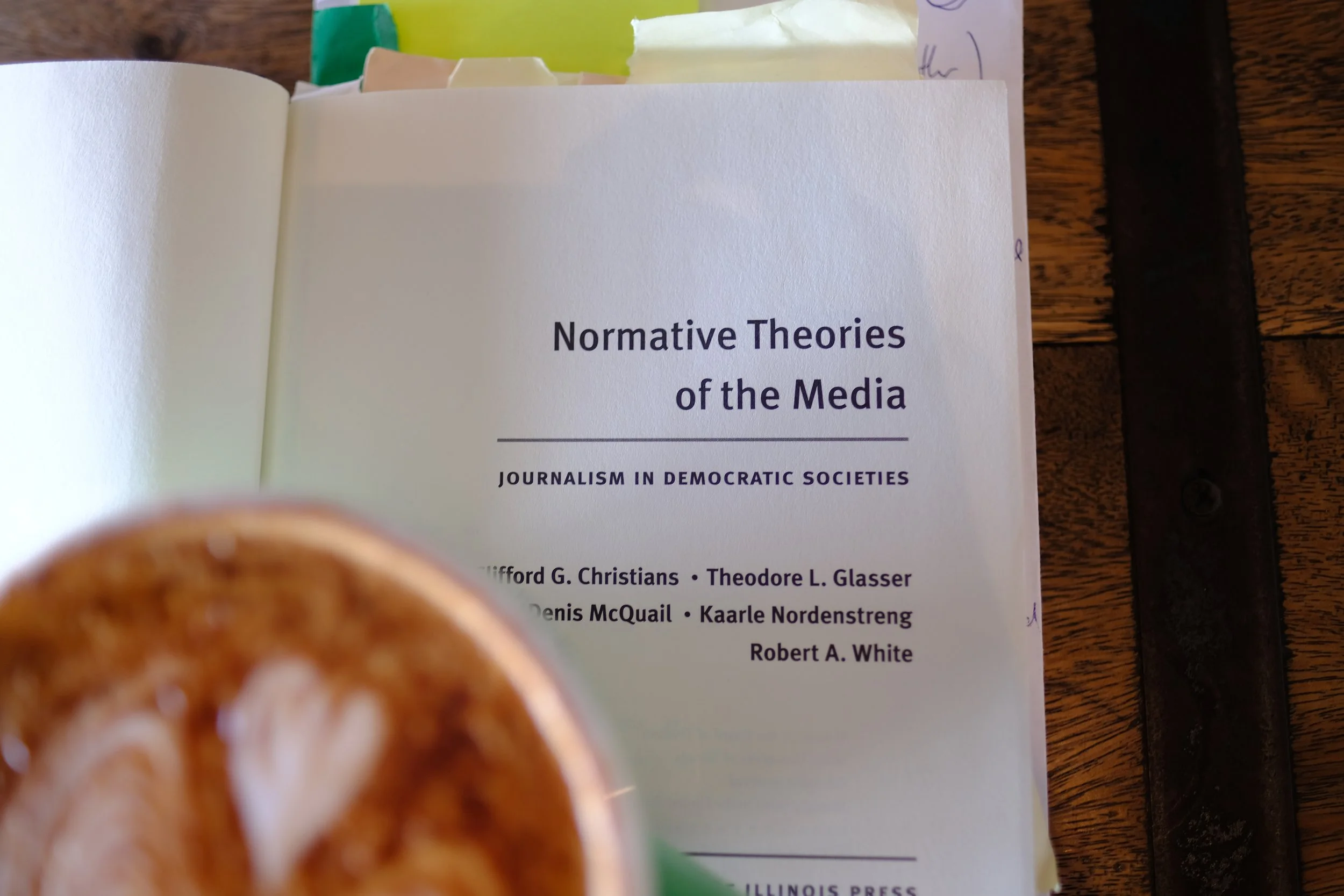 Title page of a meda book with a cappuccino in soft focus in front of it