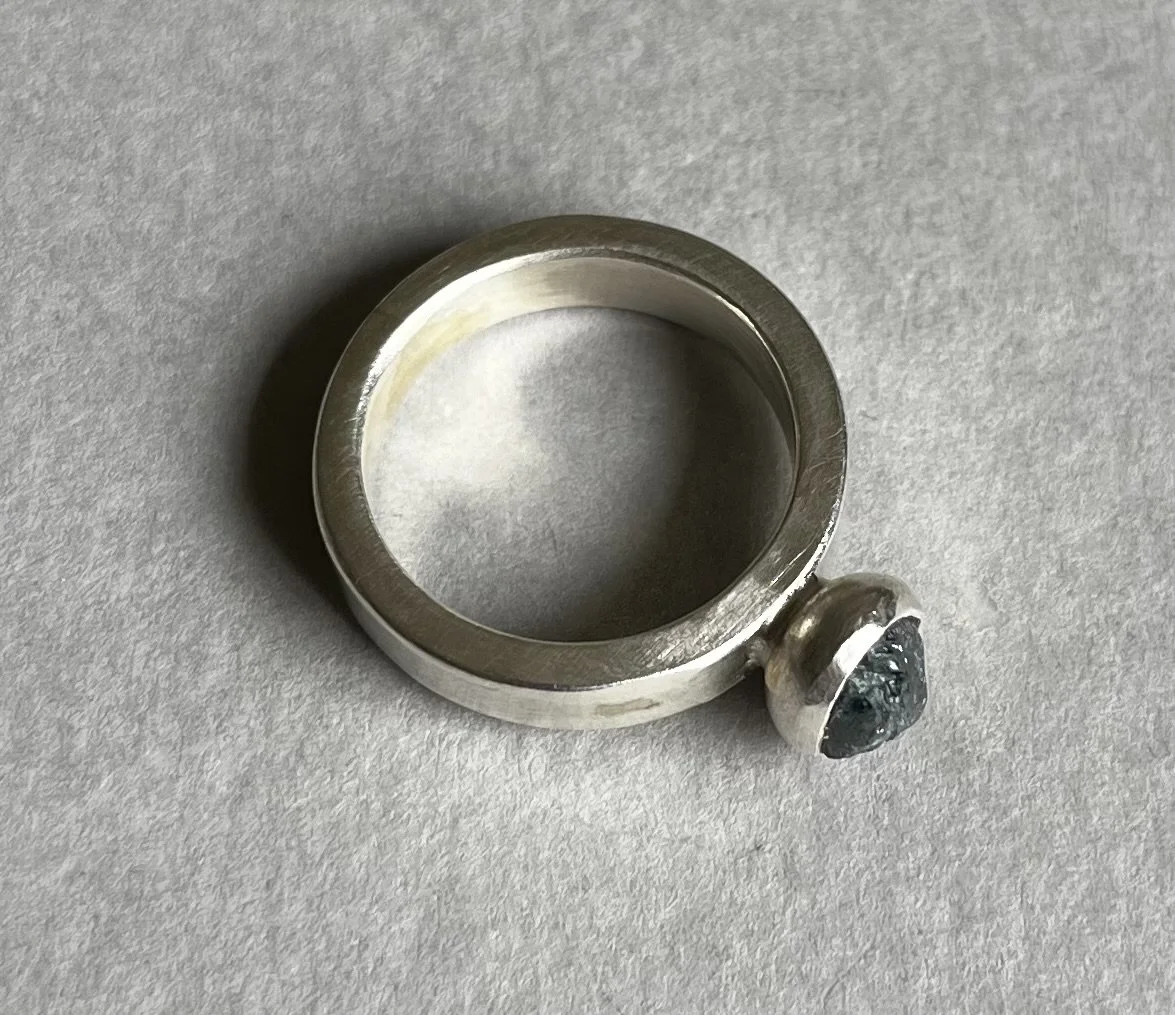 Silver with uncut diamond