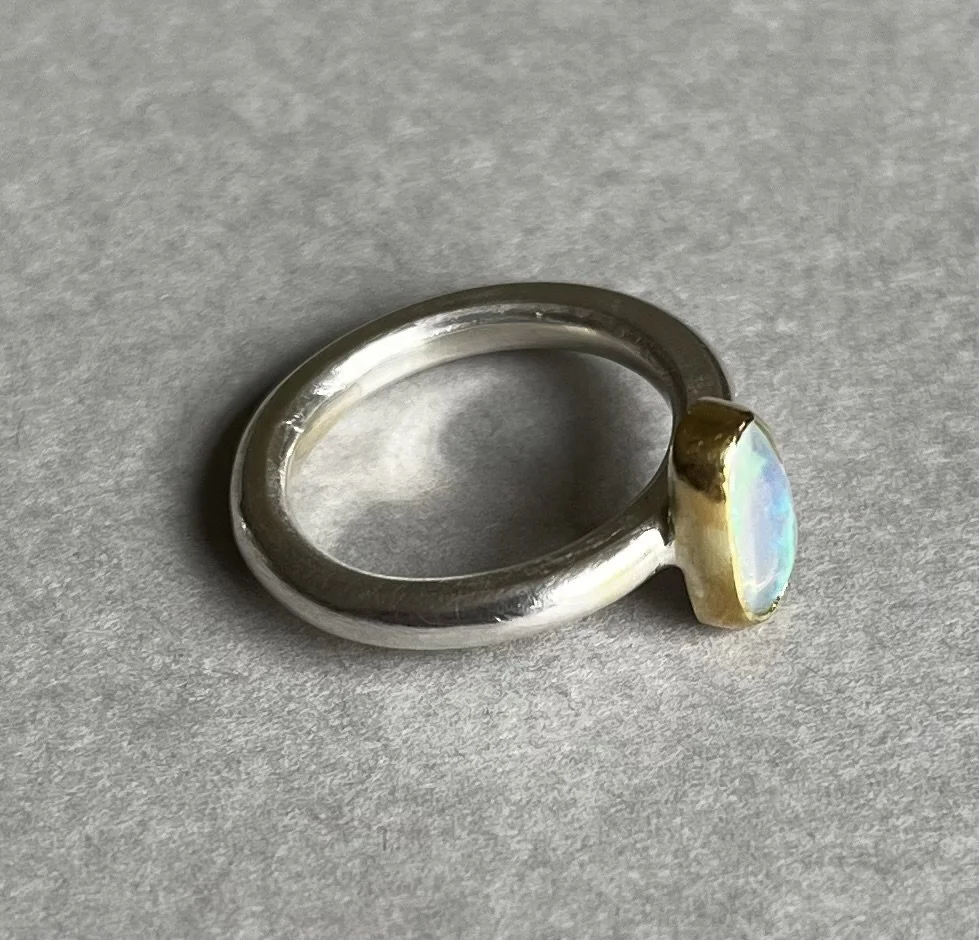 Silver with opal in 18ct gold setting