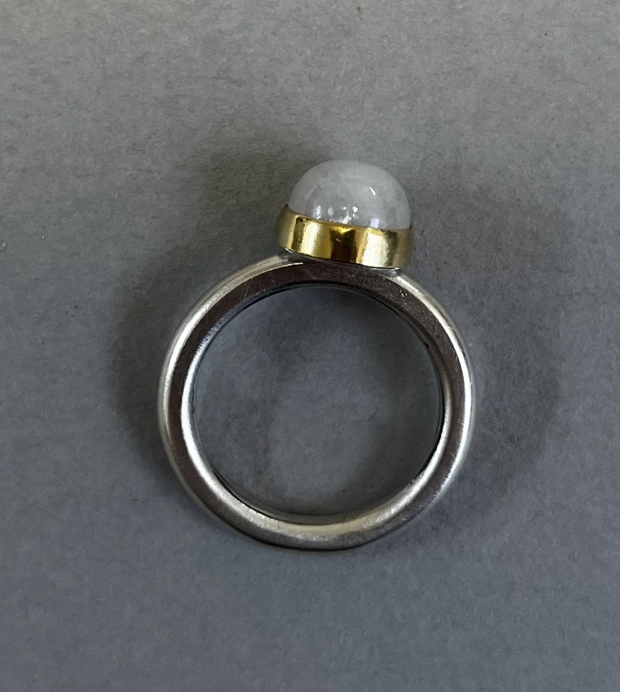Silver with 9ct gold and rainbow moonstone, size O