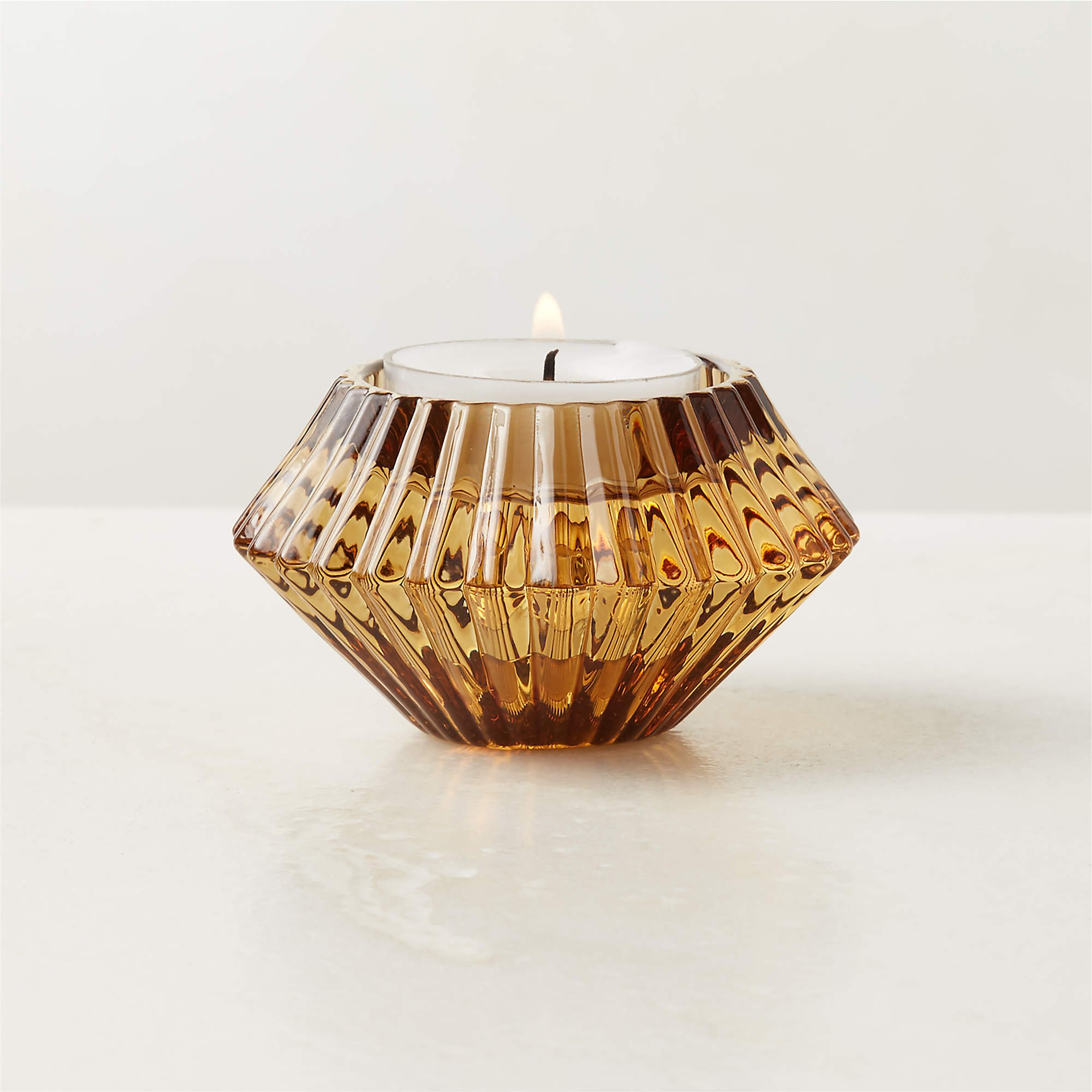 Nova Ribbed Amber Glass Reversible Candle Holder (3"Wx3"Dx1.75"H)
*Can be used with votive OR taper candles!