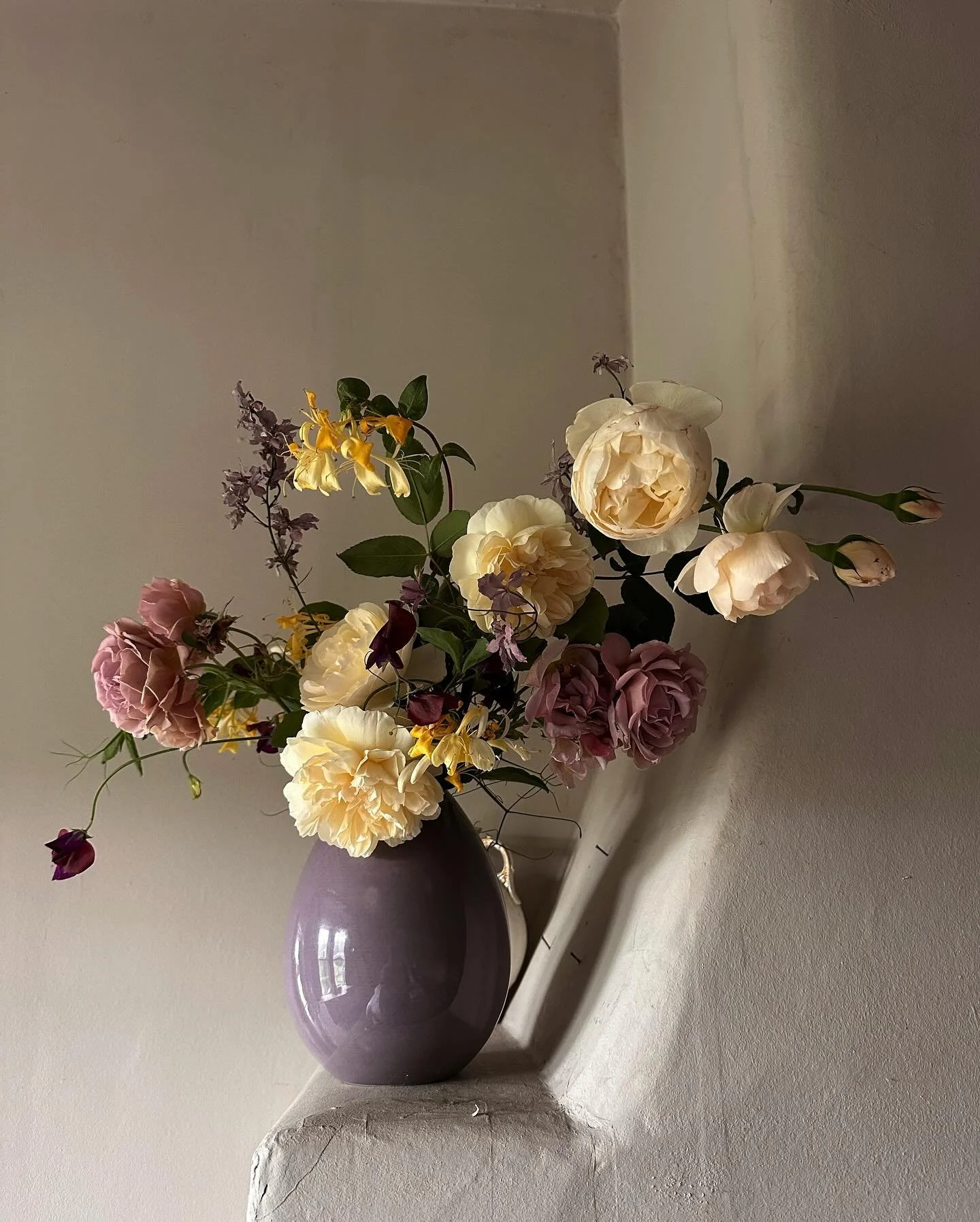 Last of the summer roses, honeysuckle and sweet peas - and our fabulously weird and wonky walls for a Sunday morning. The roses are enjoying their second bloom and the sweet peas are currently at their flowery, scented prime, thanks to unplanned and 