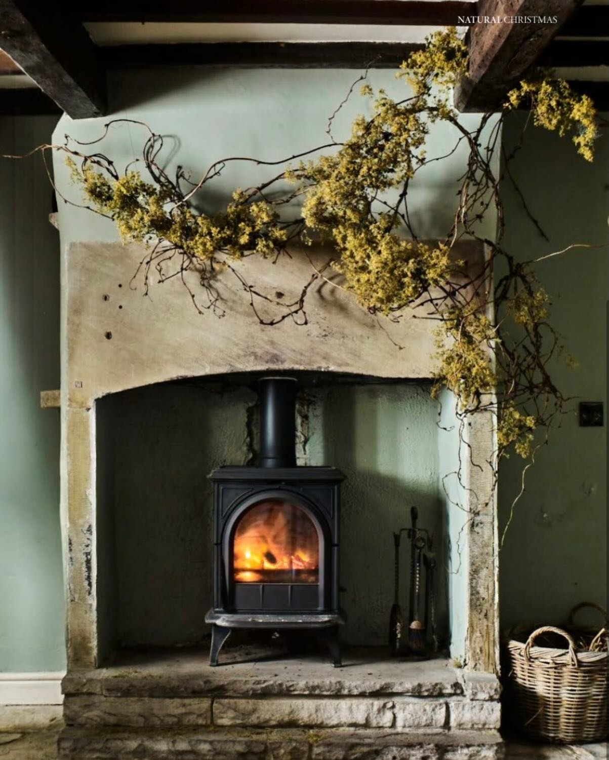 More from the @gardens_illustrated feature. A natural, festive fireplace design created using discarded materials - prunings from an unruly akebia and dried alchemilla mollis flowers, which were rescued on their journey to the tip. 
Full details - wh