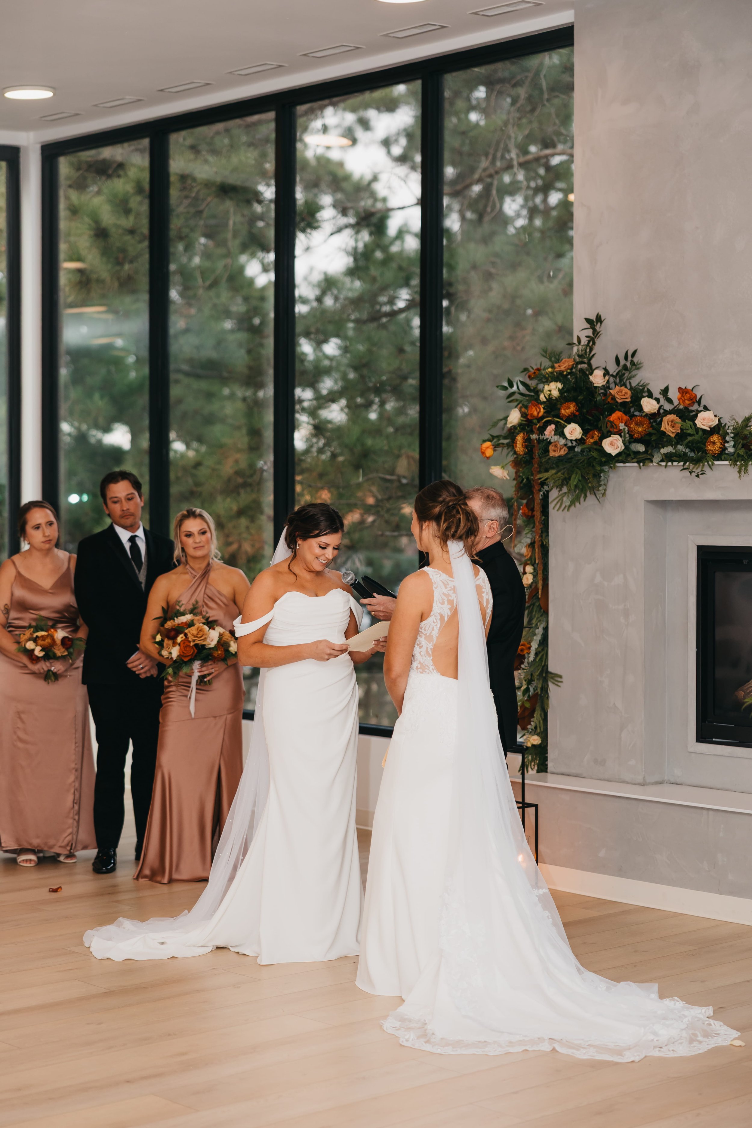 brides-exchanging-rings-fireplace-nisswa-mn.jpg.jpg