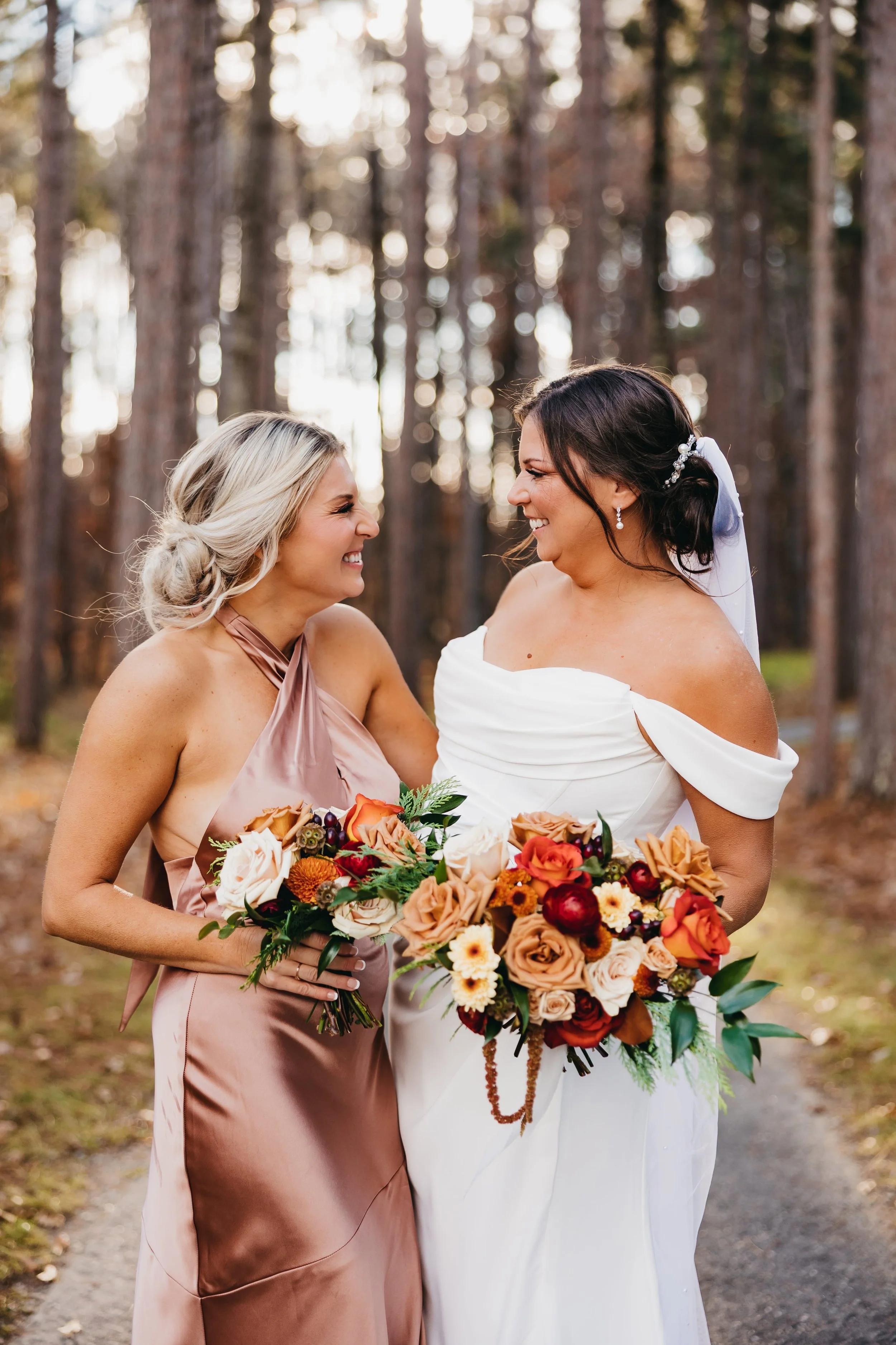 bride-and-sister-laughing-bouquets-nisswa-mn-wedding.jpg.jpg