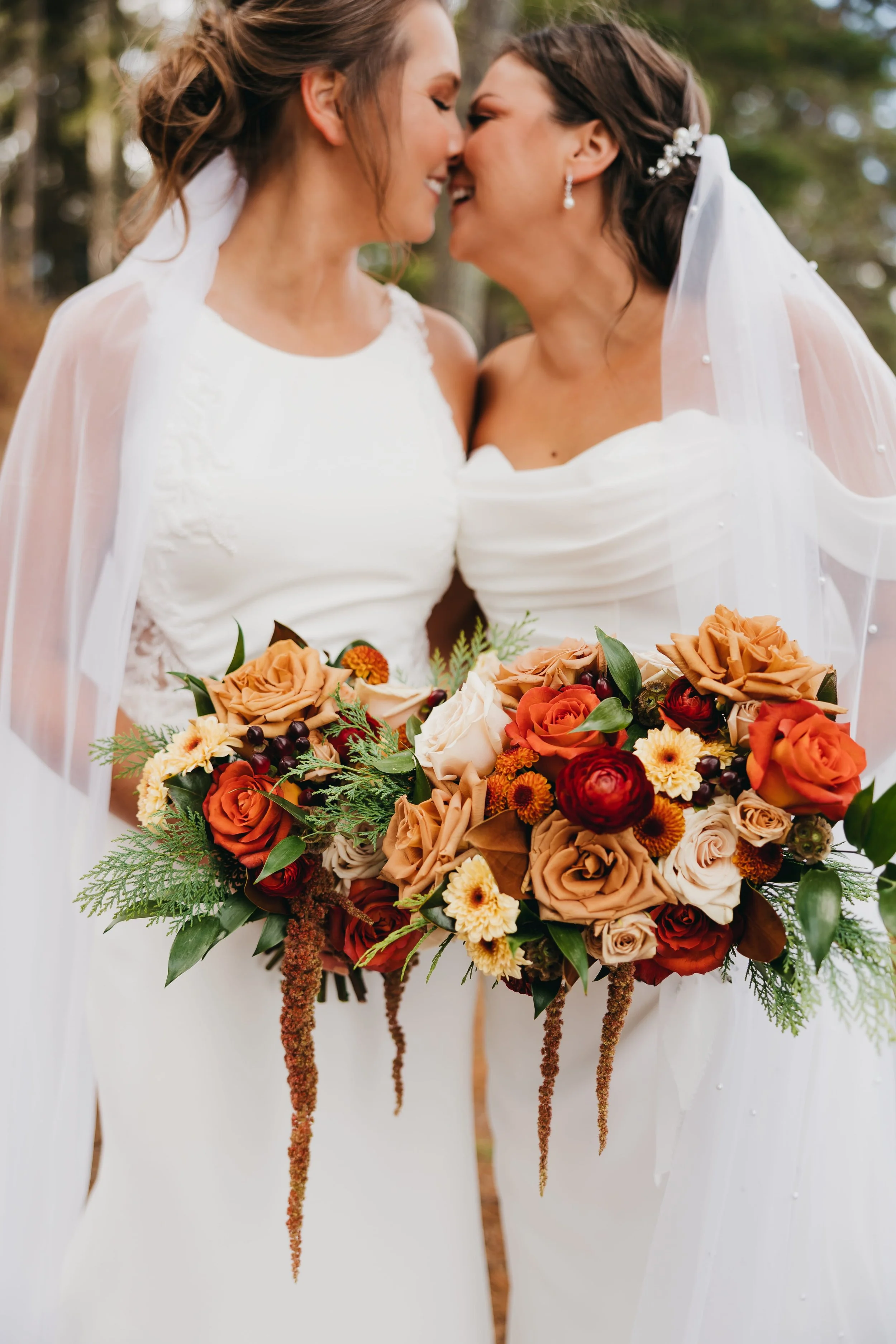 two-brides-about-to-kiss-fall-bouquets-nisswa-mn.jpg.jpg