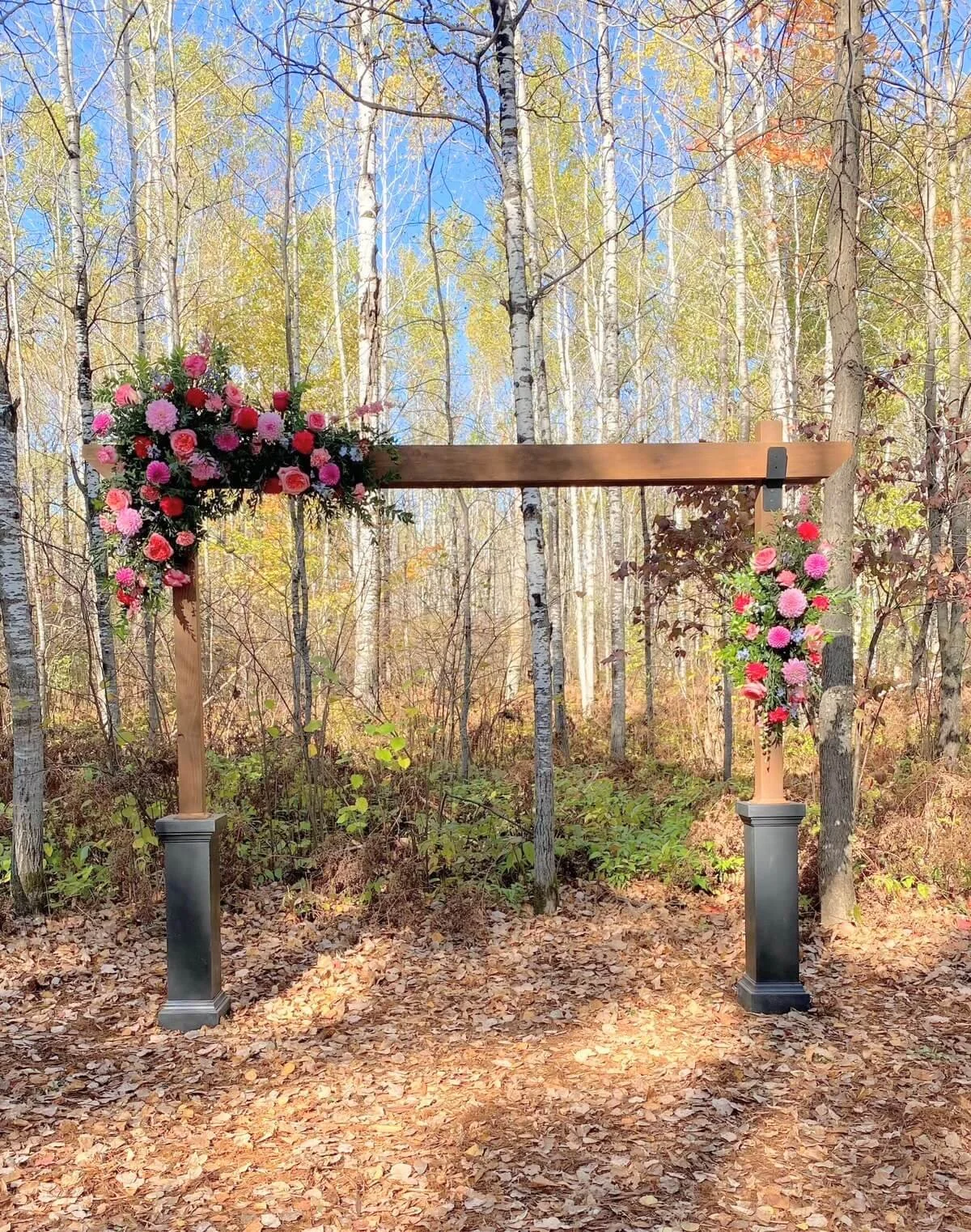 ivy-black-woodland-ceremony-arch-colorful-flowers-duluth.jpg