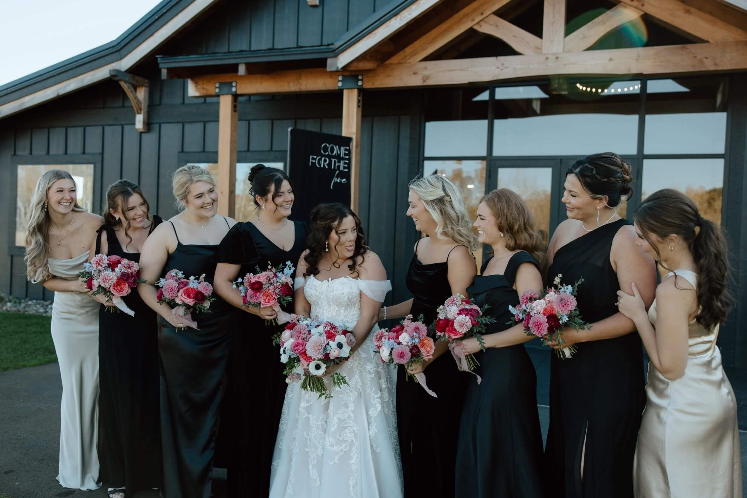 bridesmaids-looking-at-bride-bouquets-ivy-black-wedding.jpg