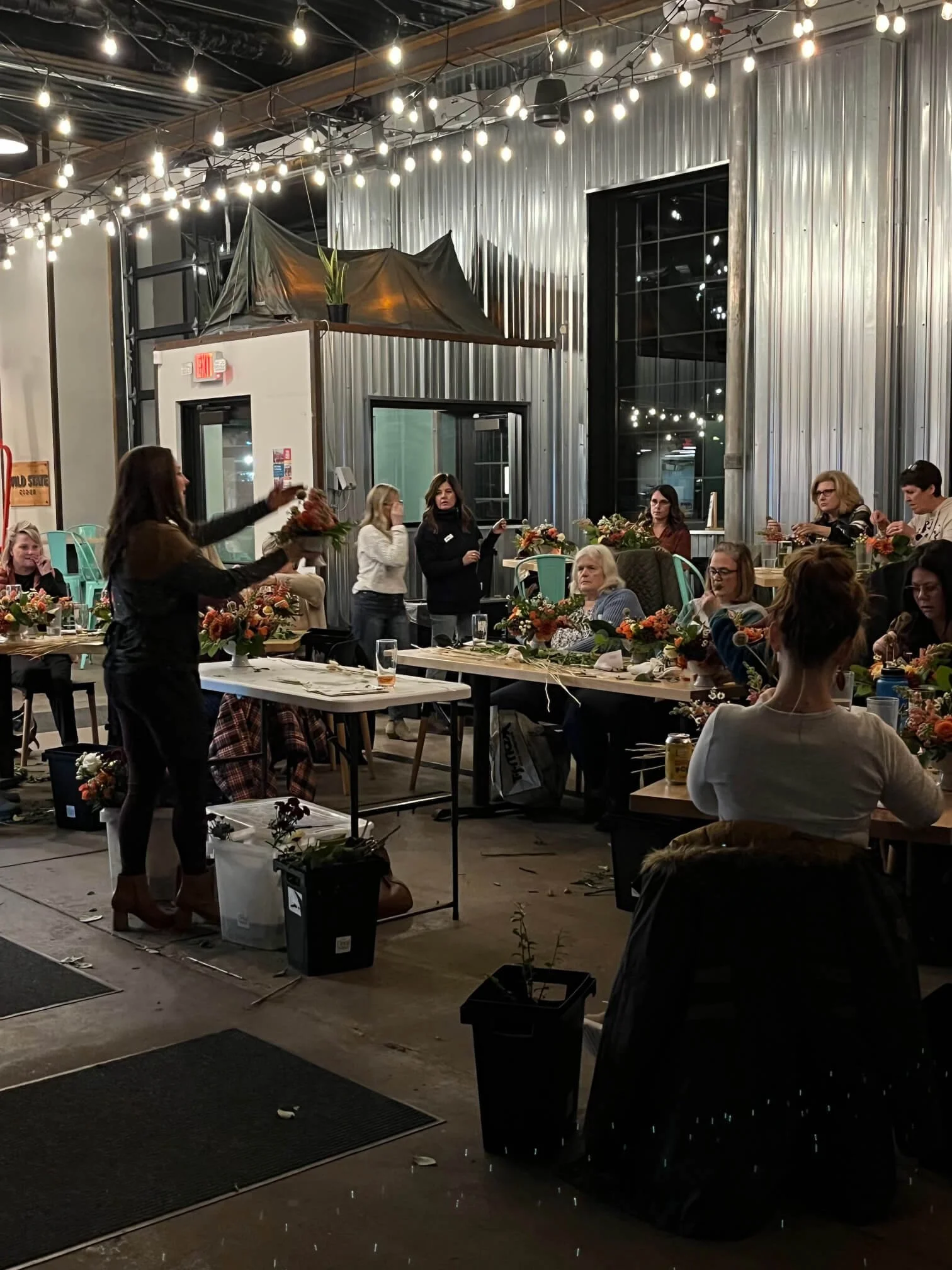 Leading a floral class in Duluth local cidery