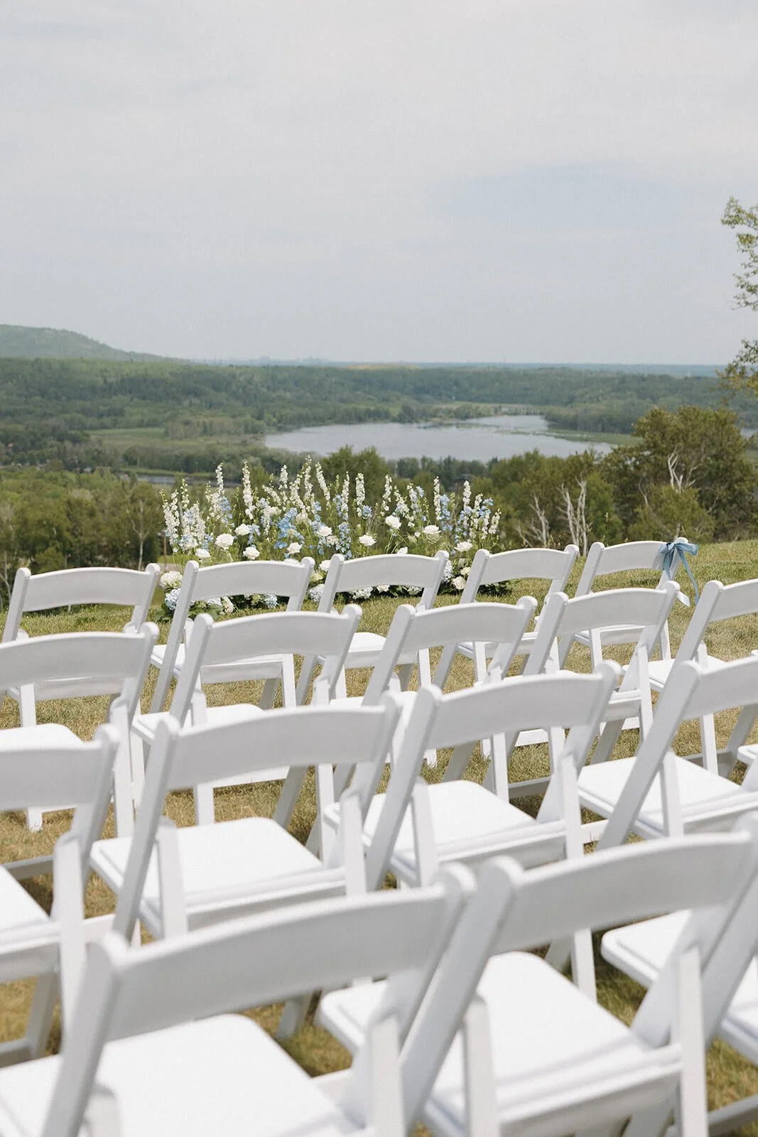 mont-du-lac-ceremony-blue-white-green-flowers.jpeg.jpg