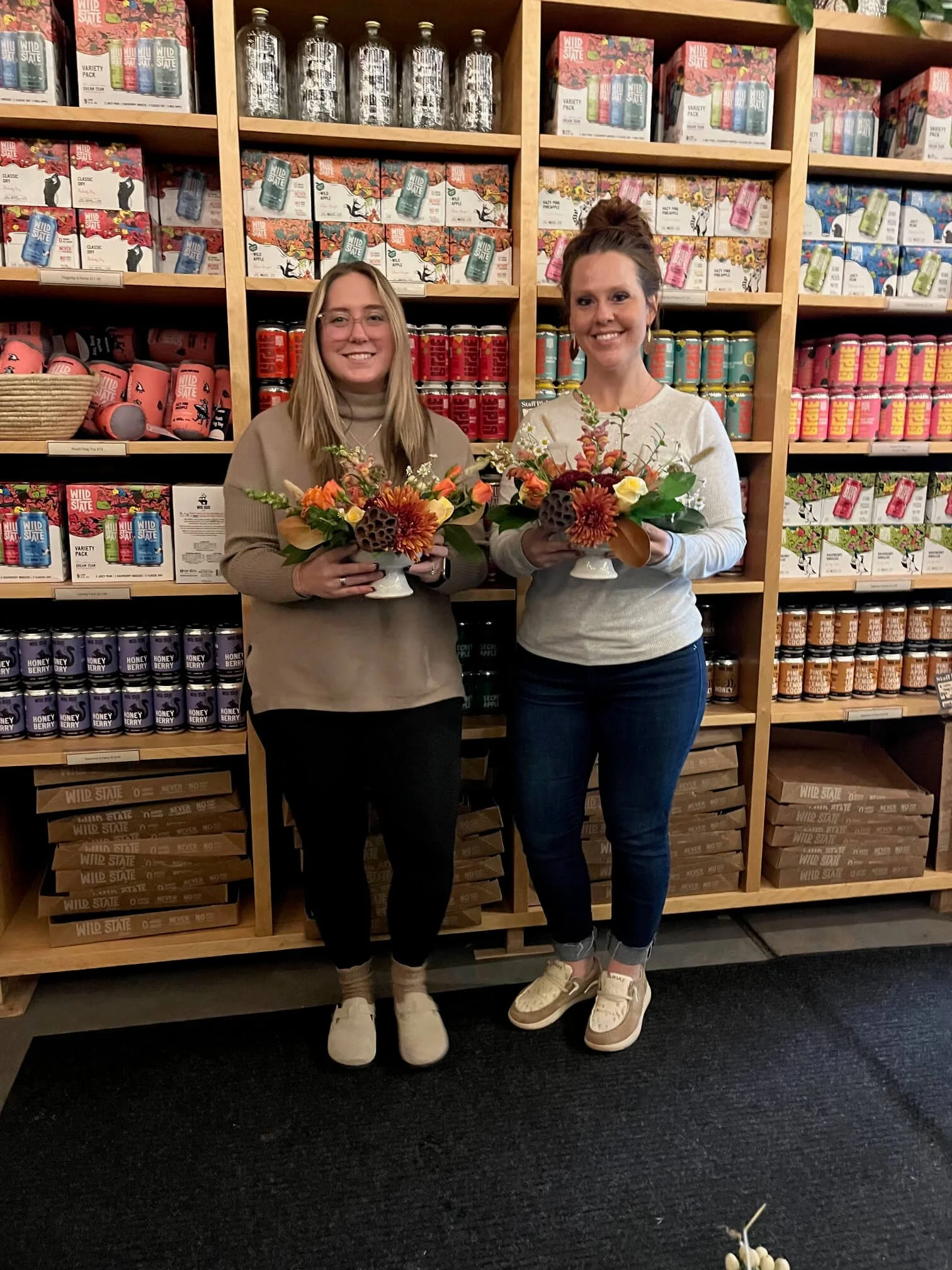 Flower class friends photo with bouquets in hand