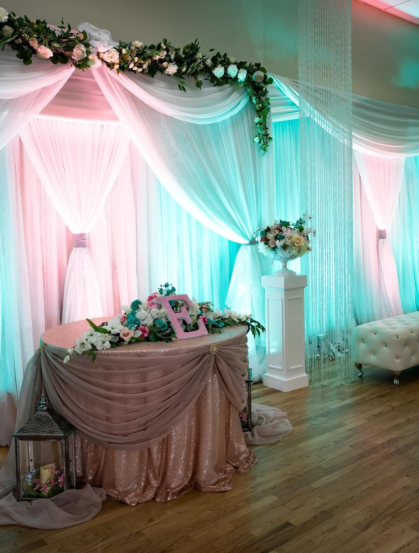 The guests at this 80th birhday celebration in April were greeted with a fun celebration. Surrounded by pink and turquoise lighting on the drapings, each table was decorated with vintage 33RPM&nbsp;&nbsp;album covers and miniature car replicas from t