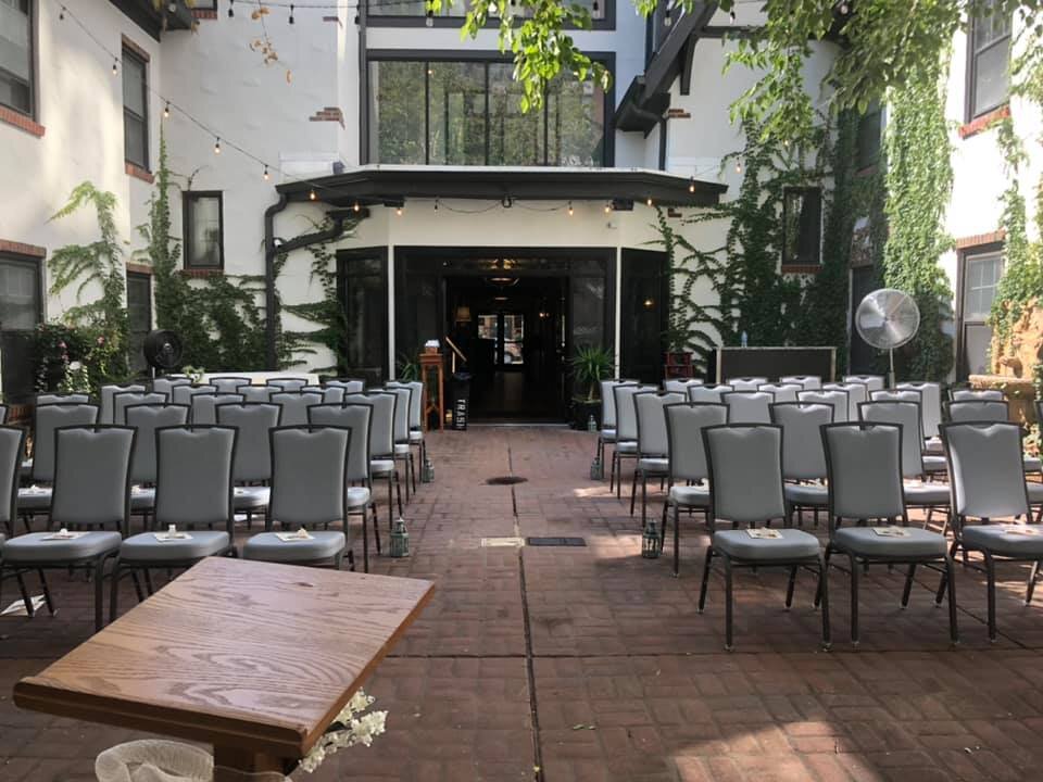 SGI - Courtyard - Ceremony with banquet chairs.jpg