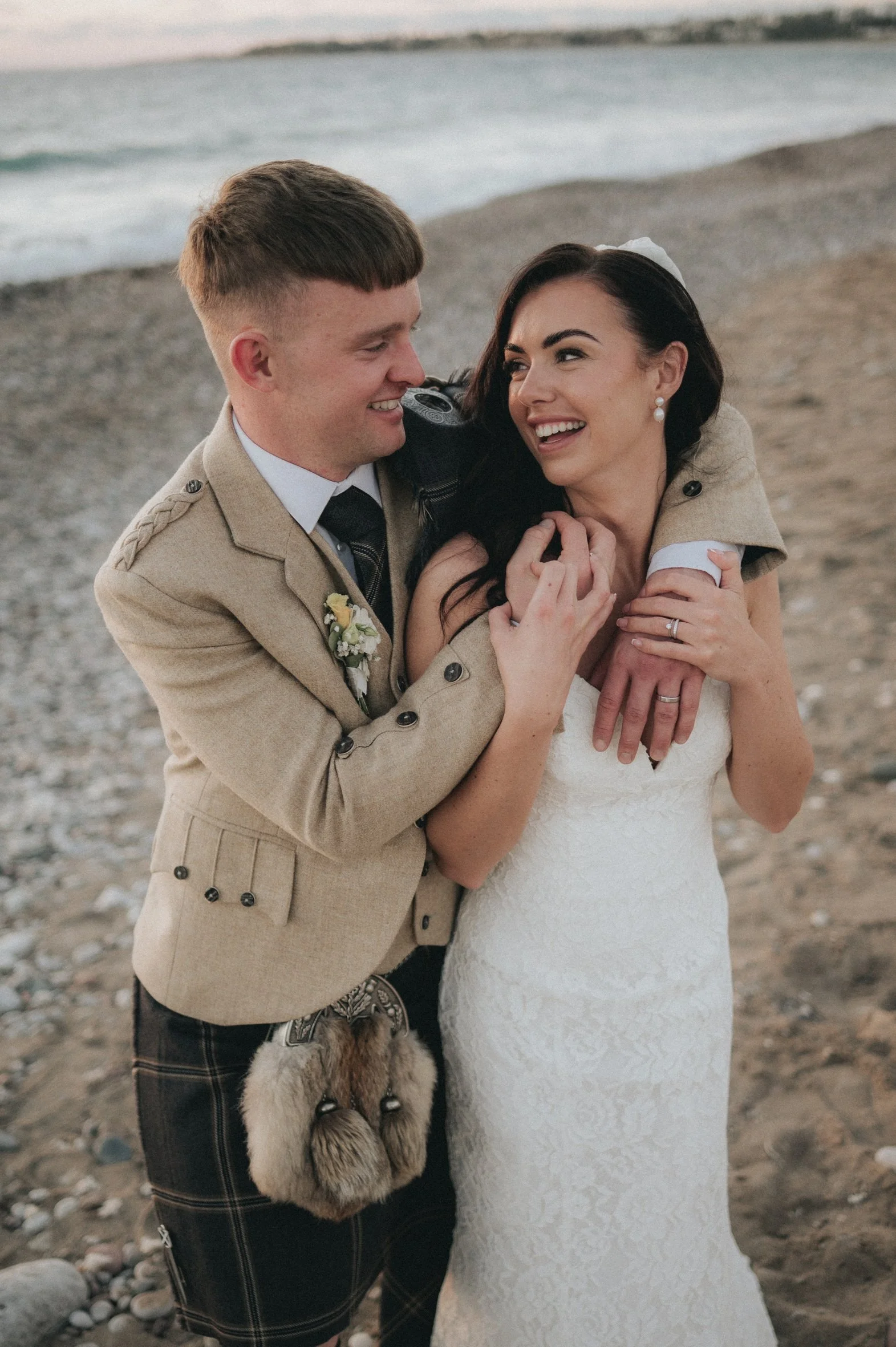 couple smiling on the beach