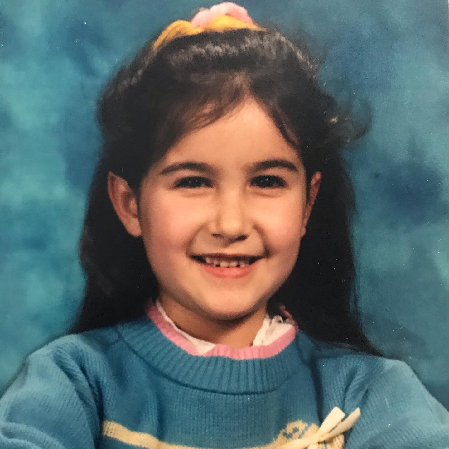 Here&rsquo;s me in all my first grade glory, thick yarn bows in my hair and all! I loved to write and illustrate stories, dance during quiet time, teach my classmates how to read, and help people feel welcome and included. The seeds of who I am today