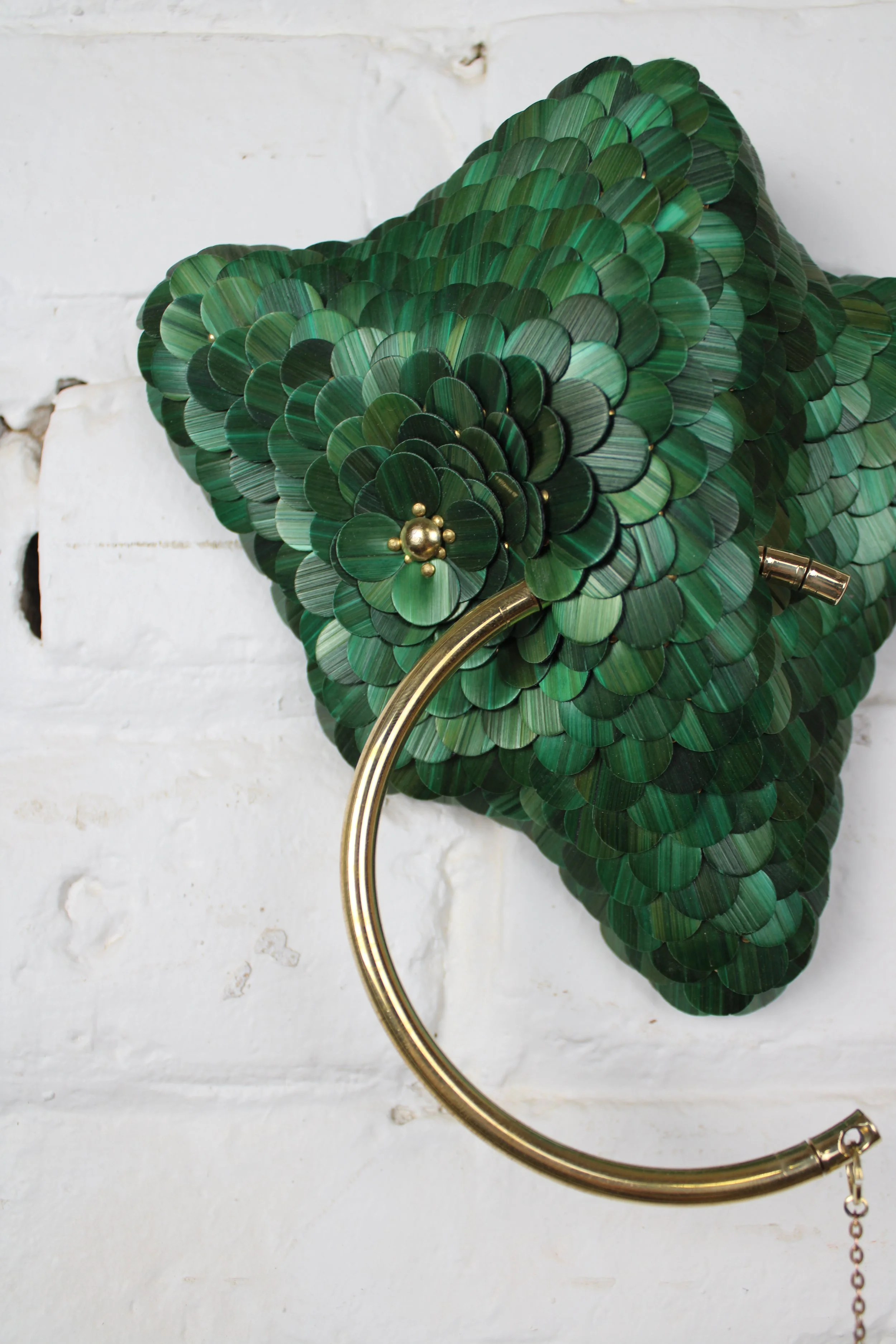 Contemporary small green and gold sculpture for wall named Invisible Monster 20, Teach series from the Amoebas Realm collection. Made with rye straw , brass and wood. Made by the artist Jonathän Jouan in 2026. 