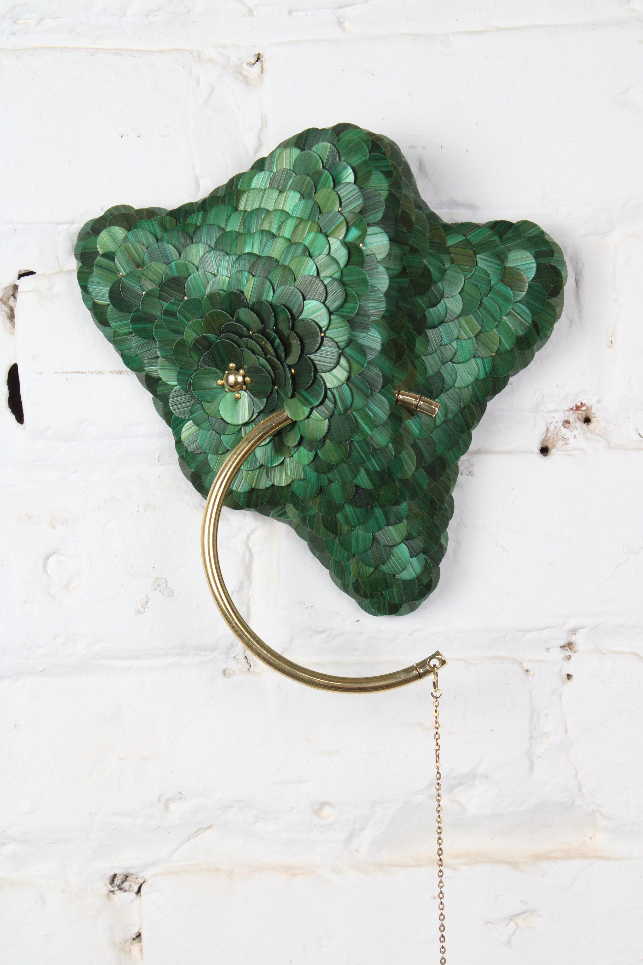 Contemporary small green and gold sculpture for wall named Invisible Monster 20, Teach series from the Amoebas Realm collection. Made with rye straw , brass and wood. Made by the artist Jonathän Jouan in 2026. 