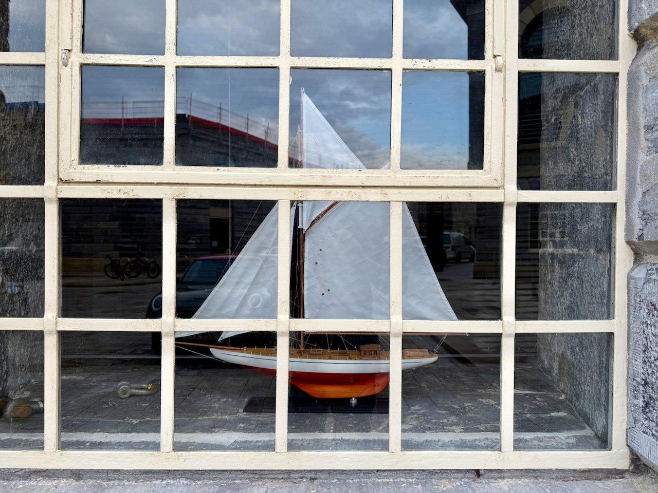 Model boat in house window