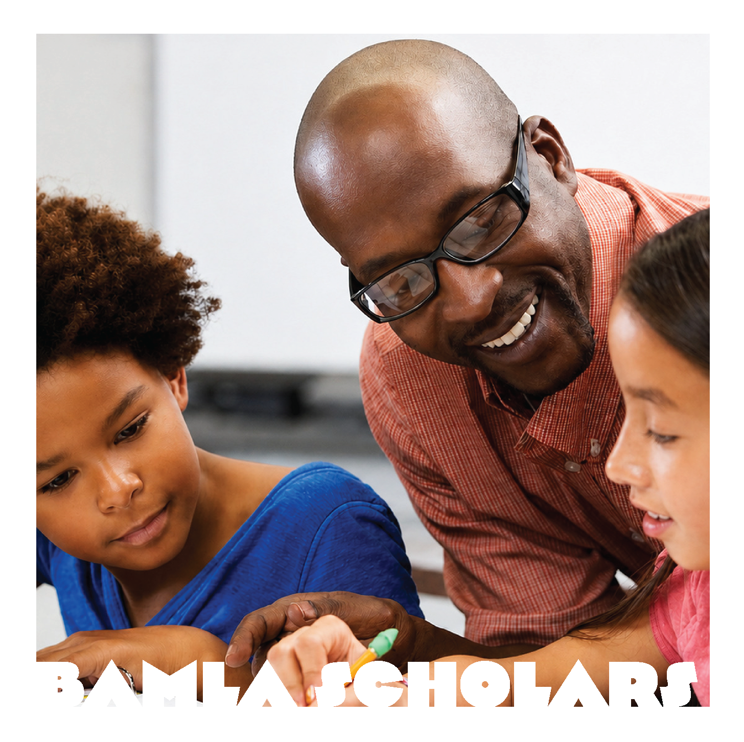A male teacher with glasses smiling, assisting two young students with a school activity in a classroom.