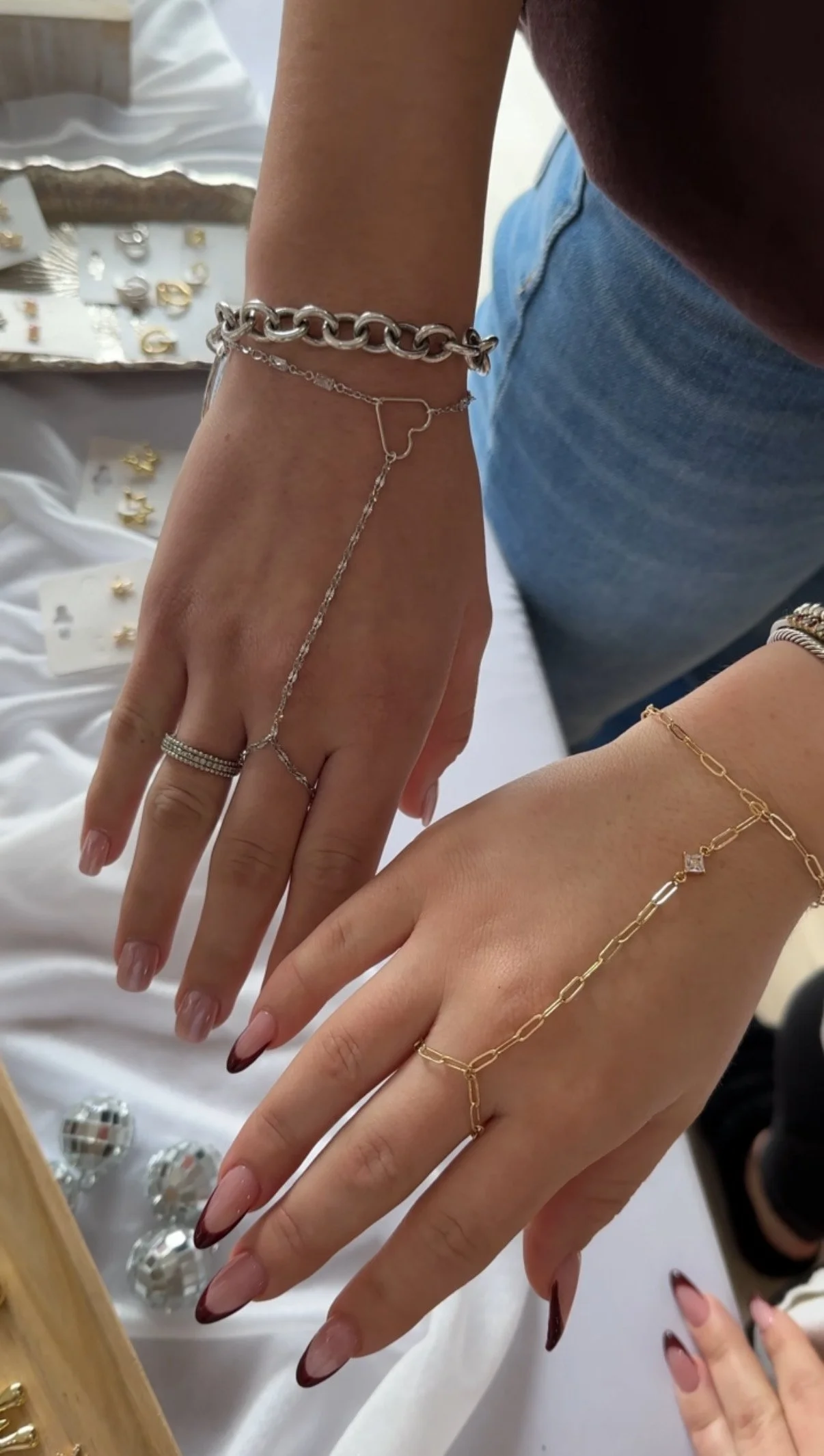 permanent jewelry hand chains in silver and gold