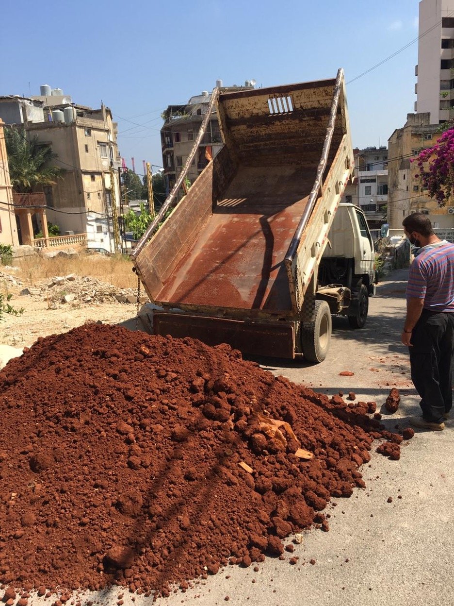 The truck filled with soil dumped in front of Kaeli Cafe.