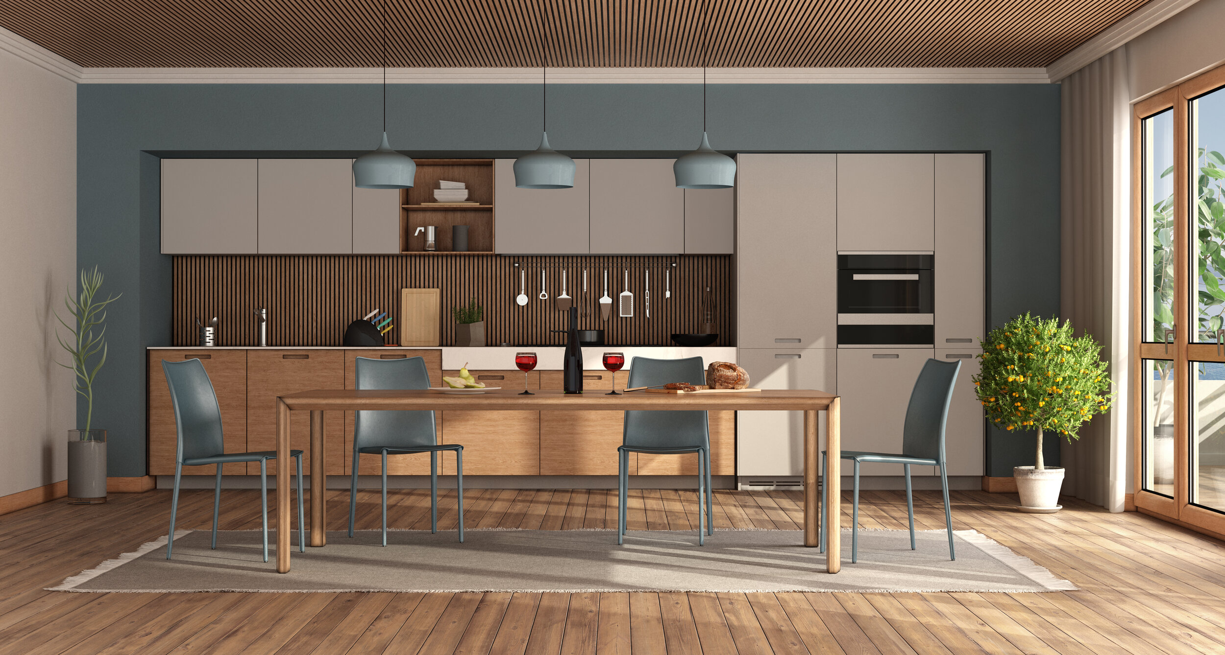 modern-kitchen-with-wooden-table-and-blue-chairs-427U8MG.jpg