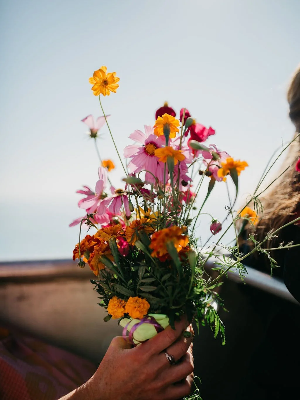 From a while back &mdash; an intimate elopement on a pearl lugger, calm waters and pretty flowers catching the sea breeze 🌸