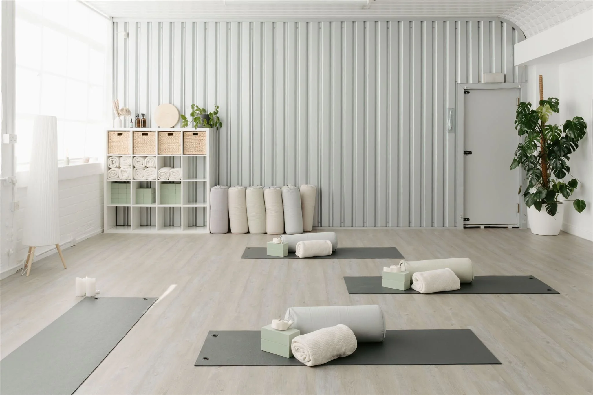 Main studio at our Glasgow East End yoga and Pilates studio, set up with mats and props ready for a class